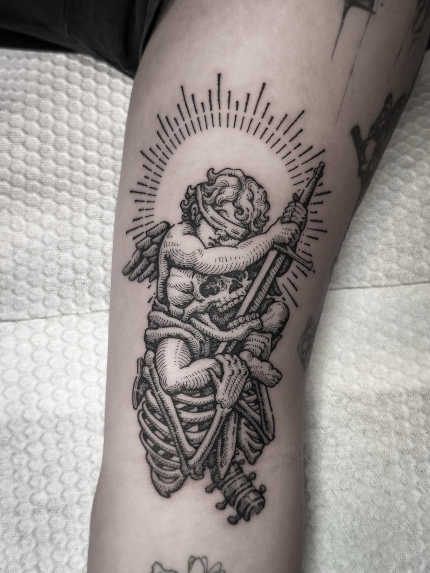 Cherub and skeleton neo-traditional tattoo on the forearm by Dokk