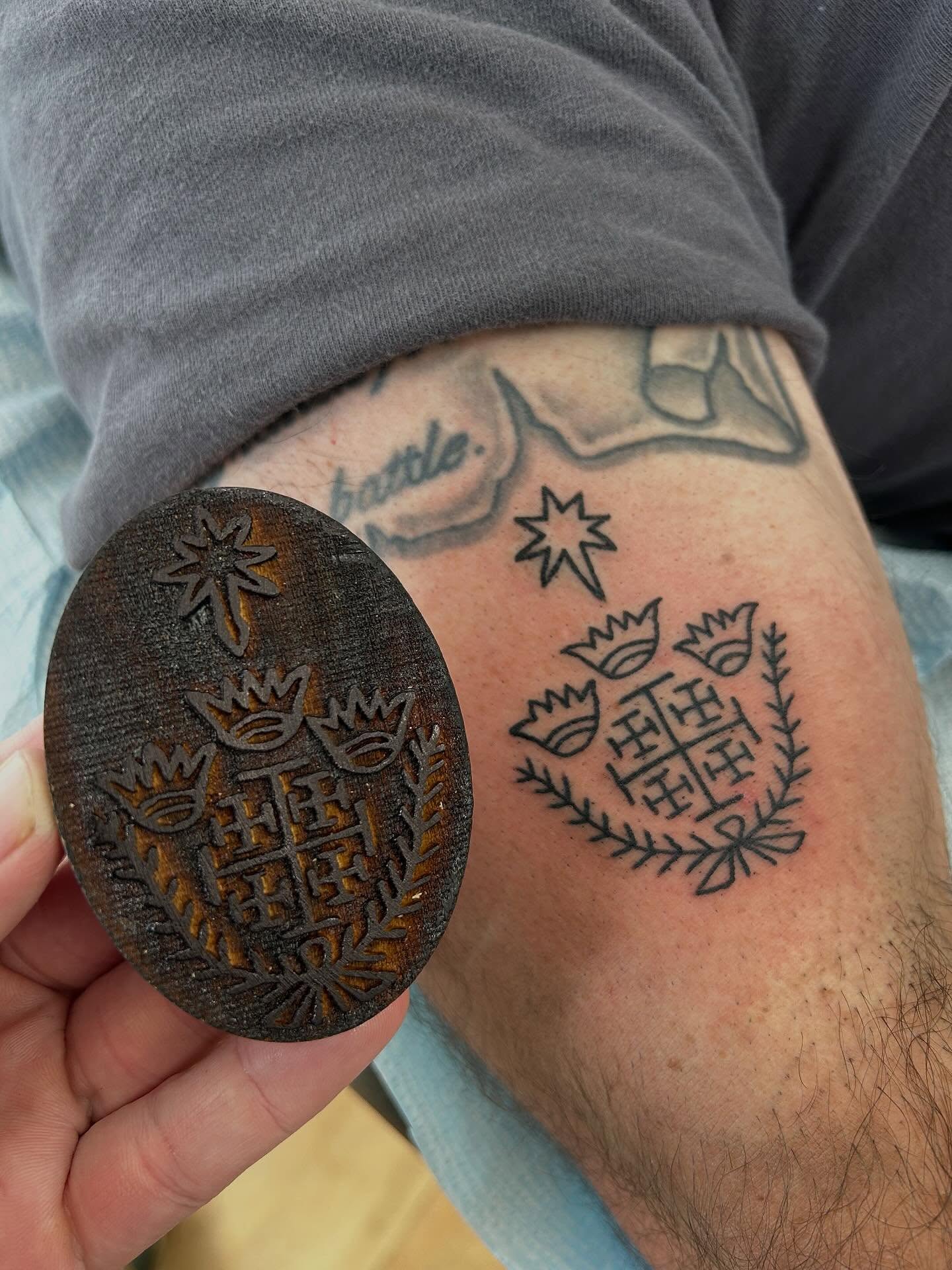 Cross and crown black and grey tattoo on the forearm by Matthew Crimson