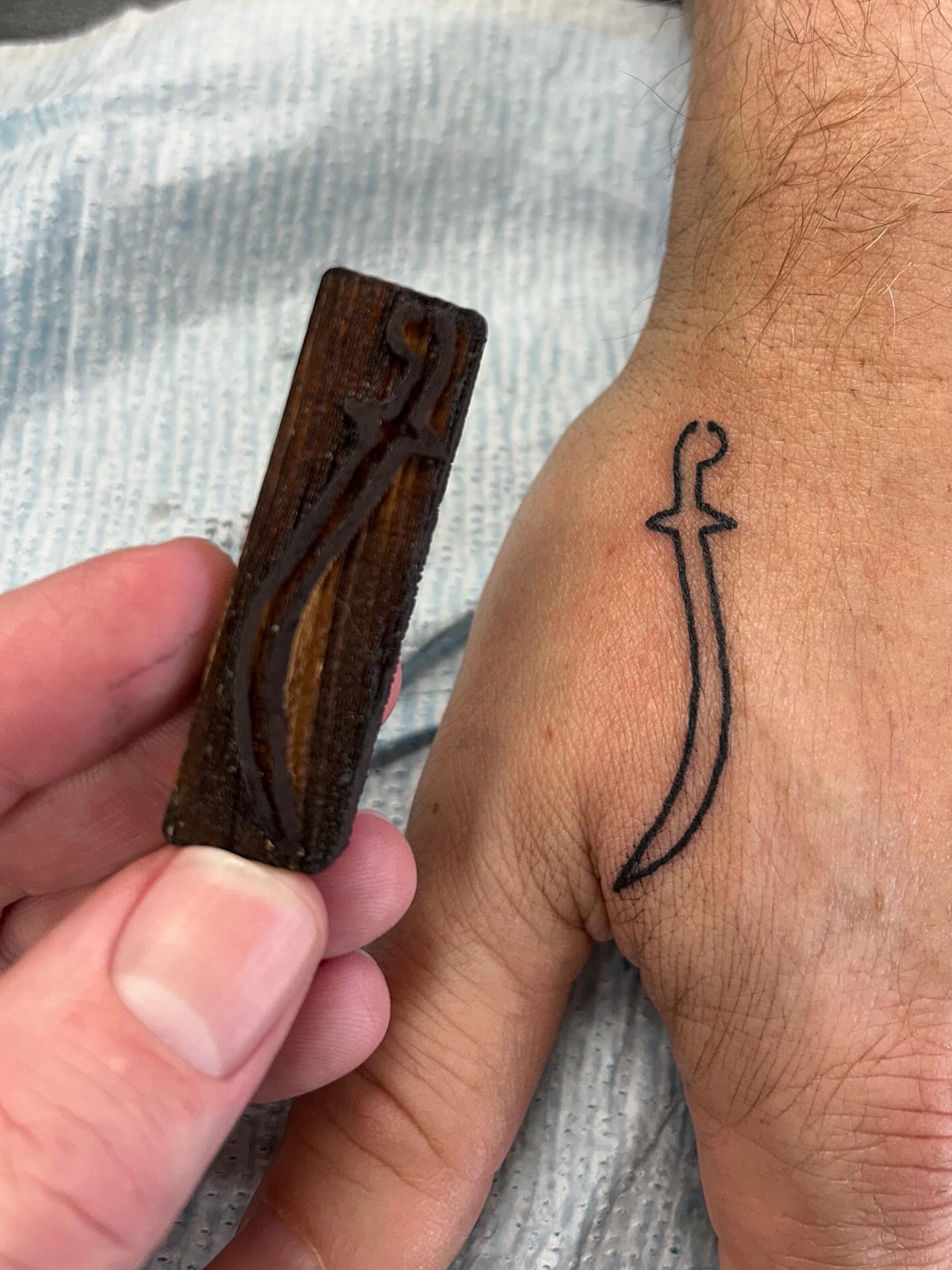 Knife black and grey tattoo on the forearm by Matthew Crimson