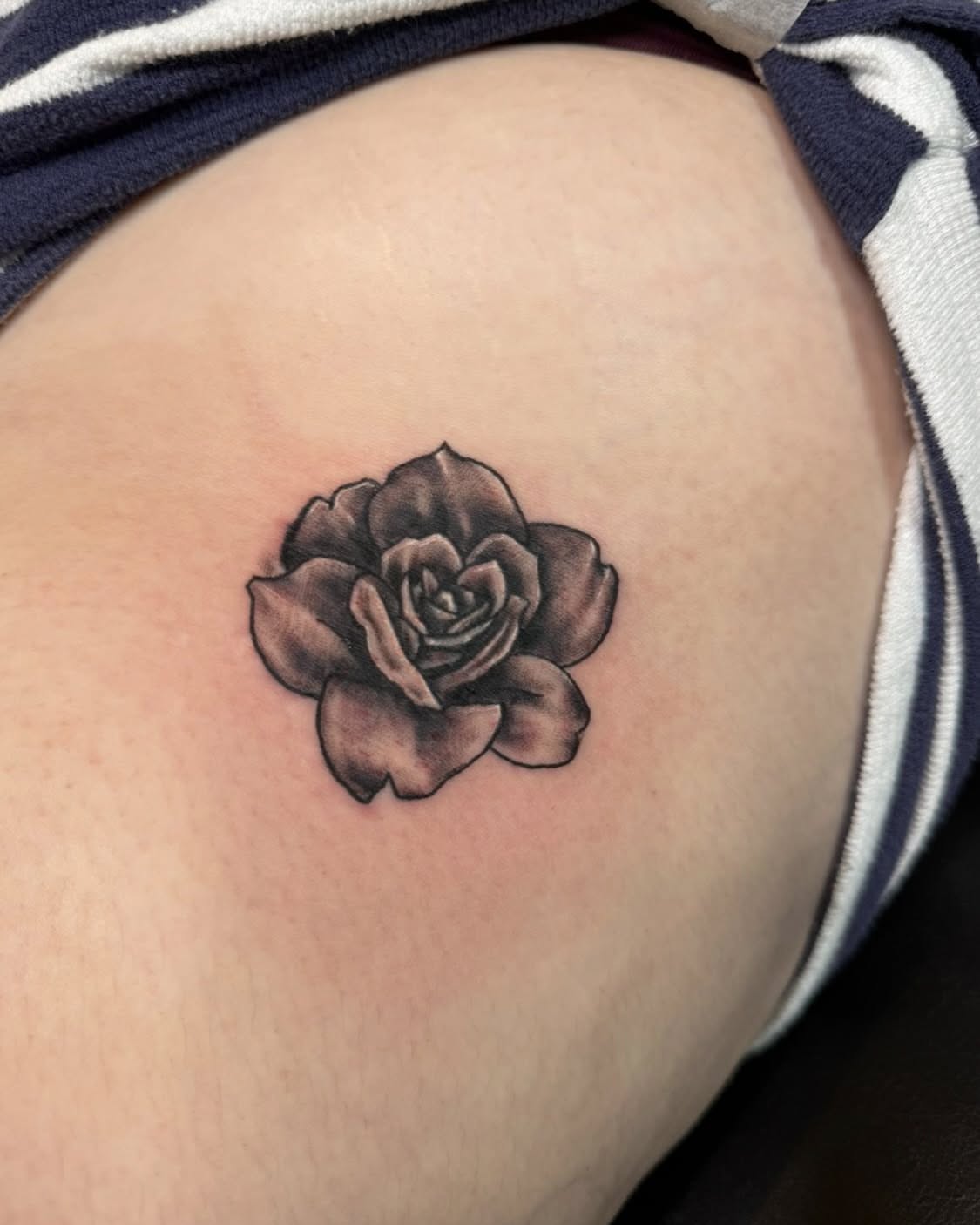 Rose black and grey tattoo on the thigh by spikecitytattoo