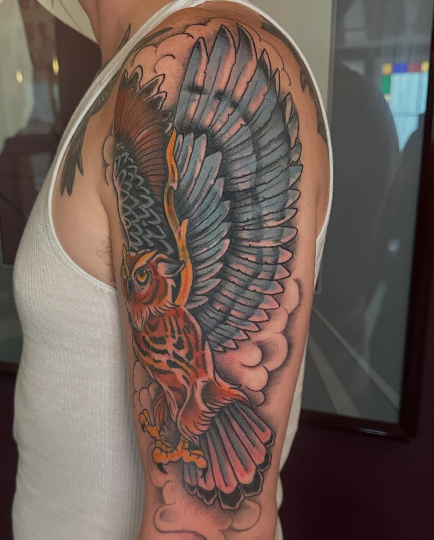 Owl American traditional tattoo on the upper arm by Stacey Colangelo
