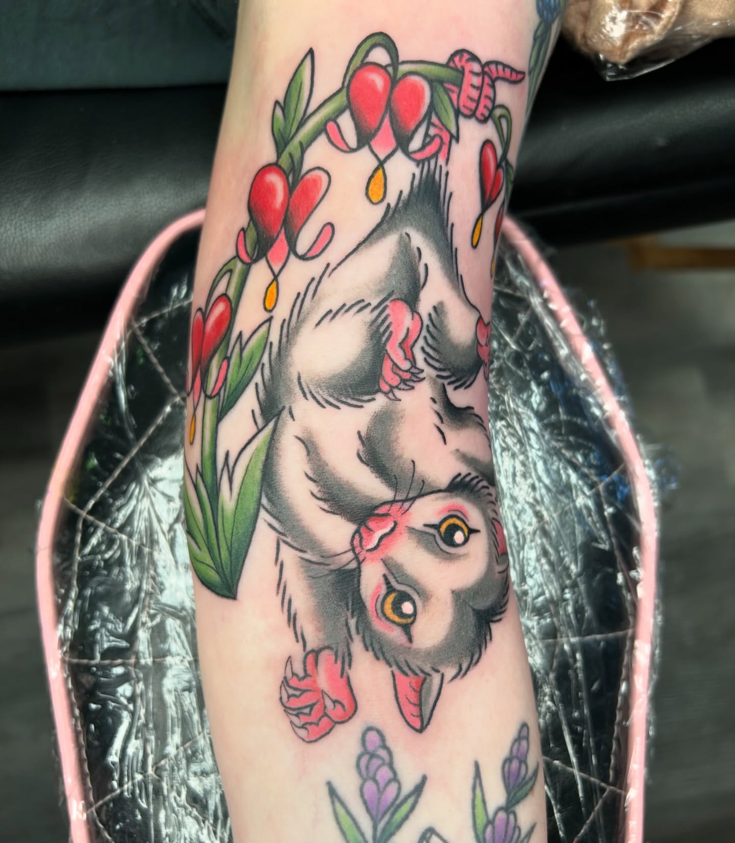 Owl with cherry blossoms American traditional tattoo on the forearm by Audrey Migitsch
