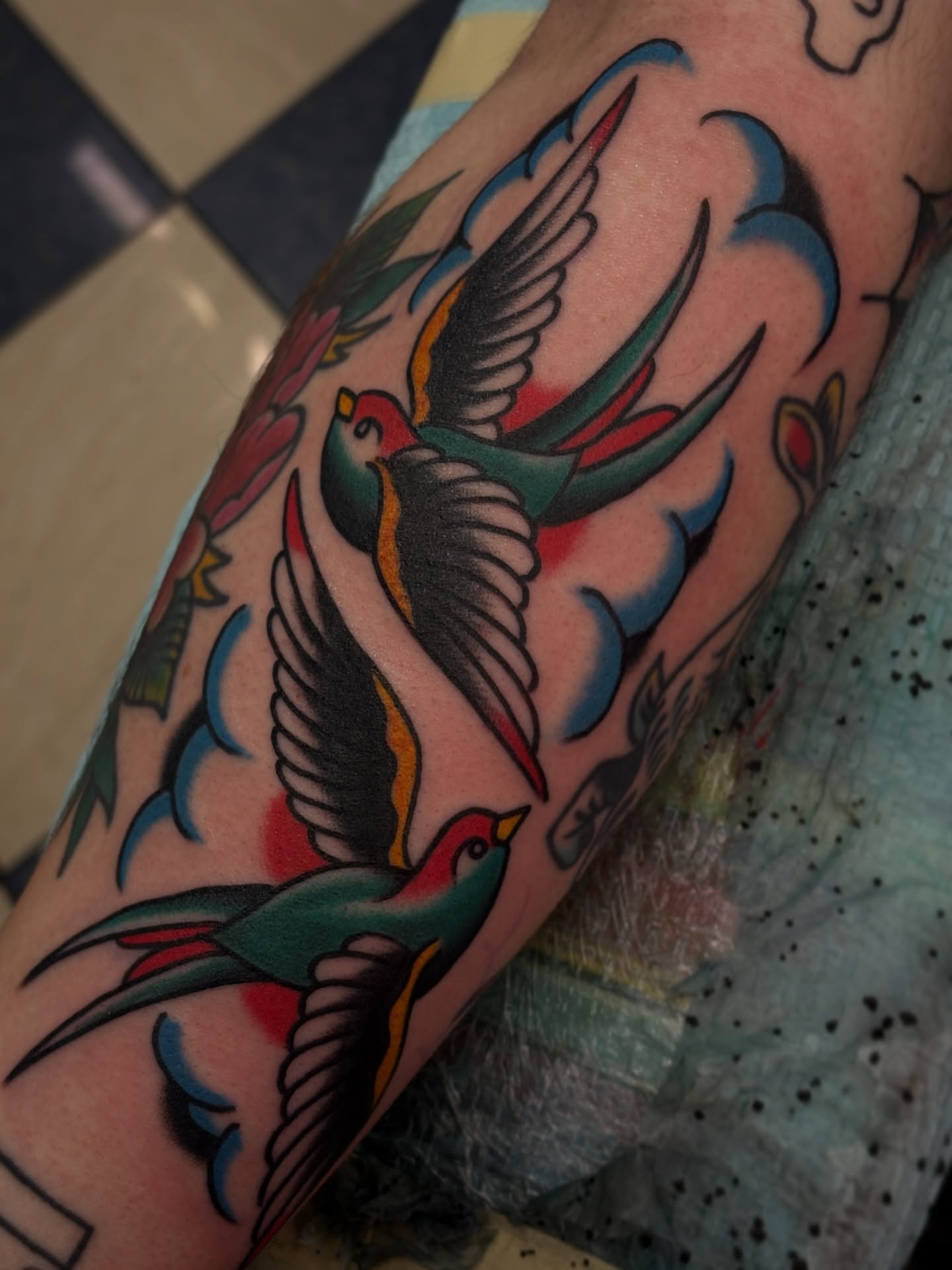 Swallows American traditional tattoo on the forearm by Carlos Gonzalez Tattoo, Dallas, Texas