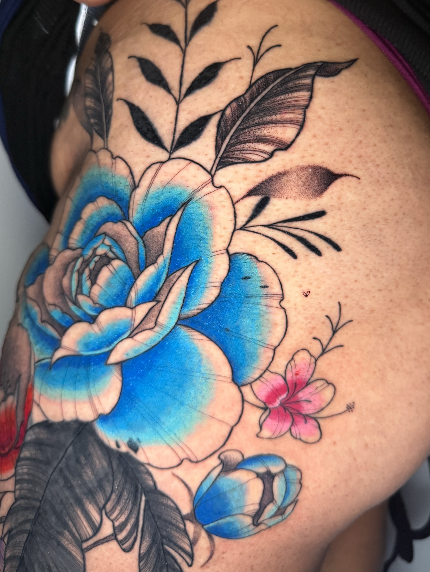Blue rose new school tattoo on the shoulder by 𝕹𝖆𝖙