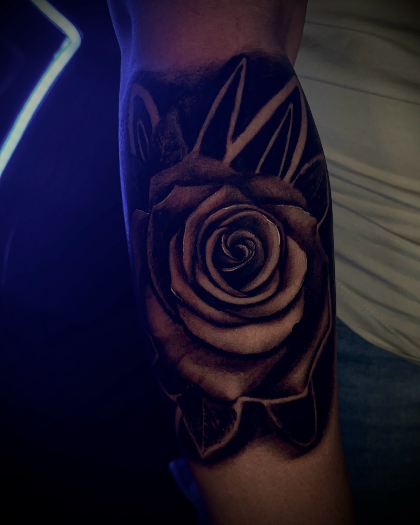 Rose realism tattoo on the forearm by Ryan Hindenach