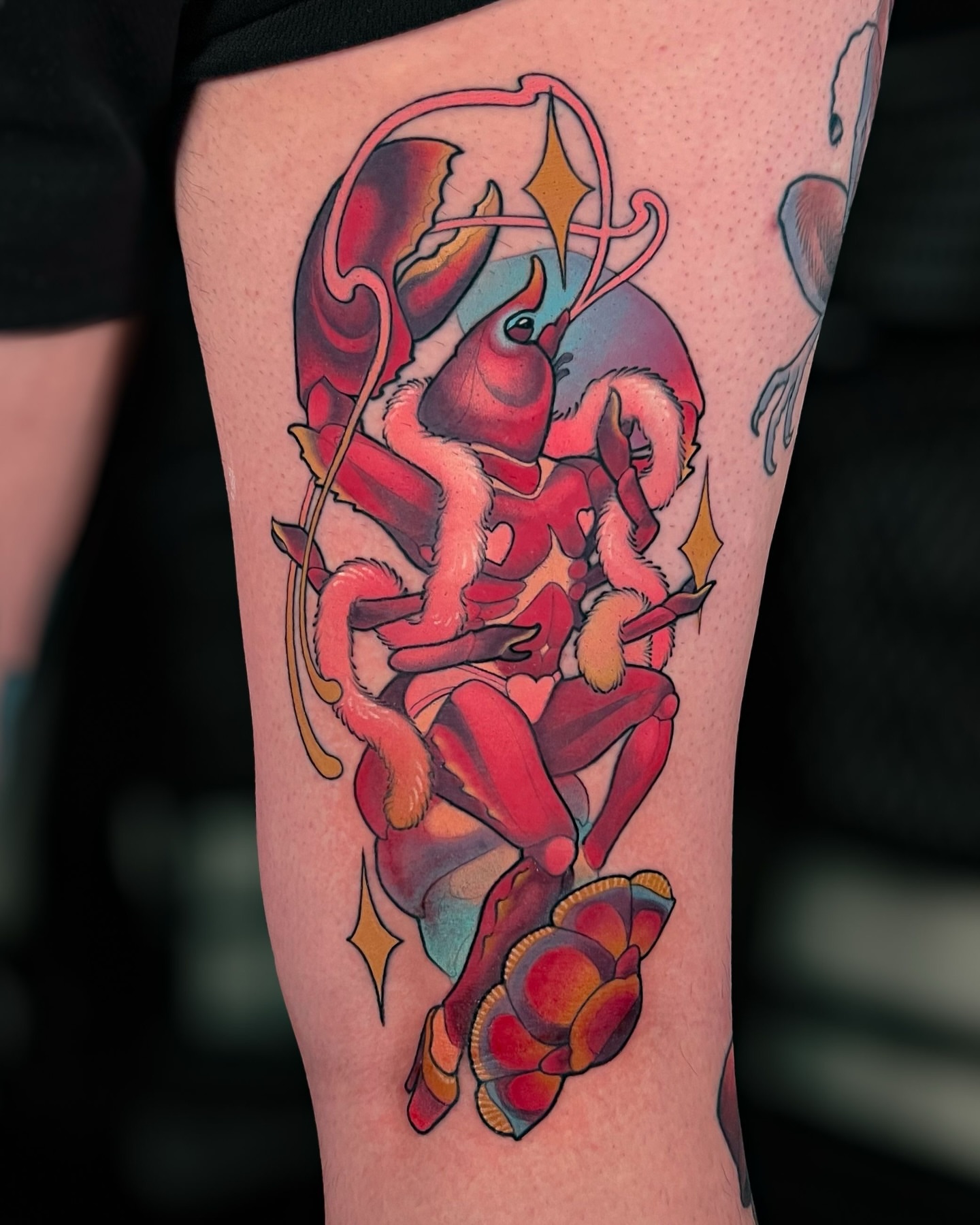 Lobster and floral new school tattoo on the forearm by Hannah Steele