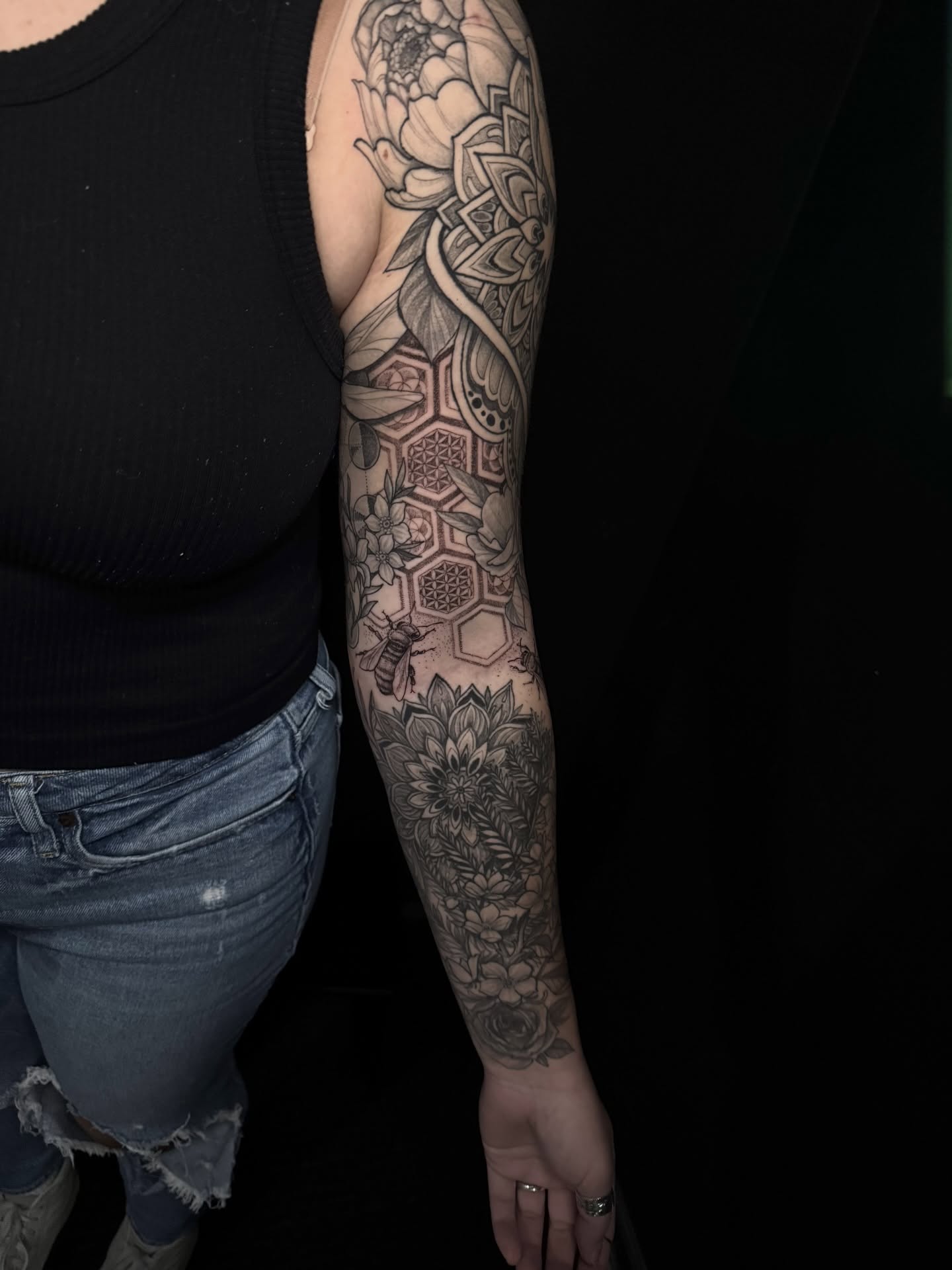 Floral and geometric patterns geometric tattoo on the forearm by Caleb Gesicki
