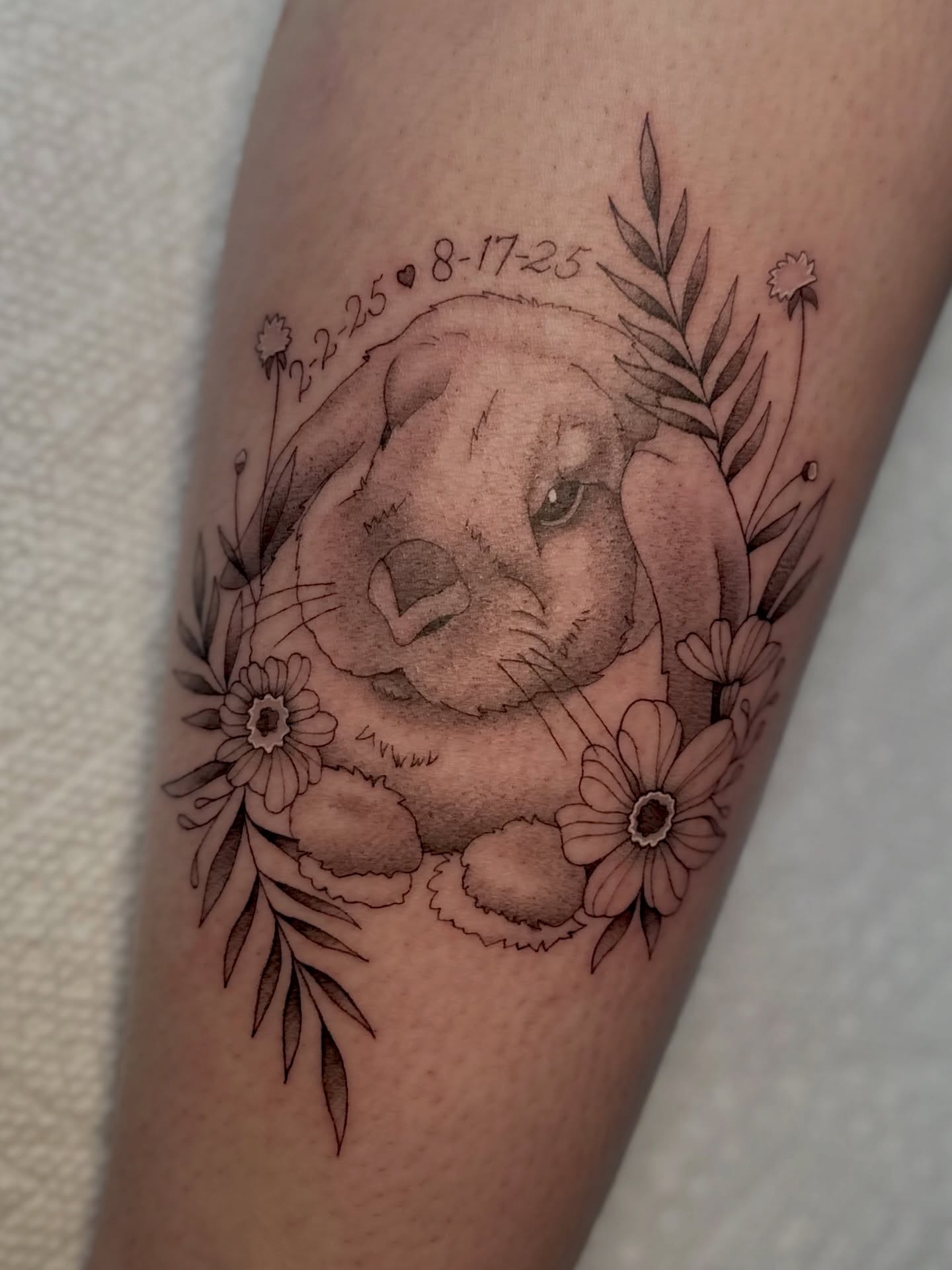 Puppy realism tattoo on the forearm by Ghost