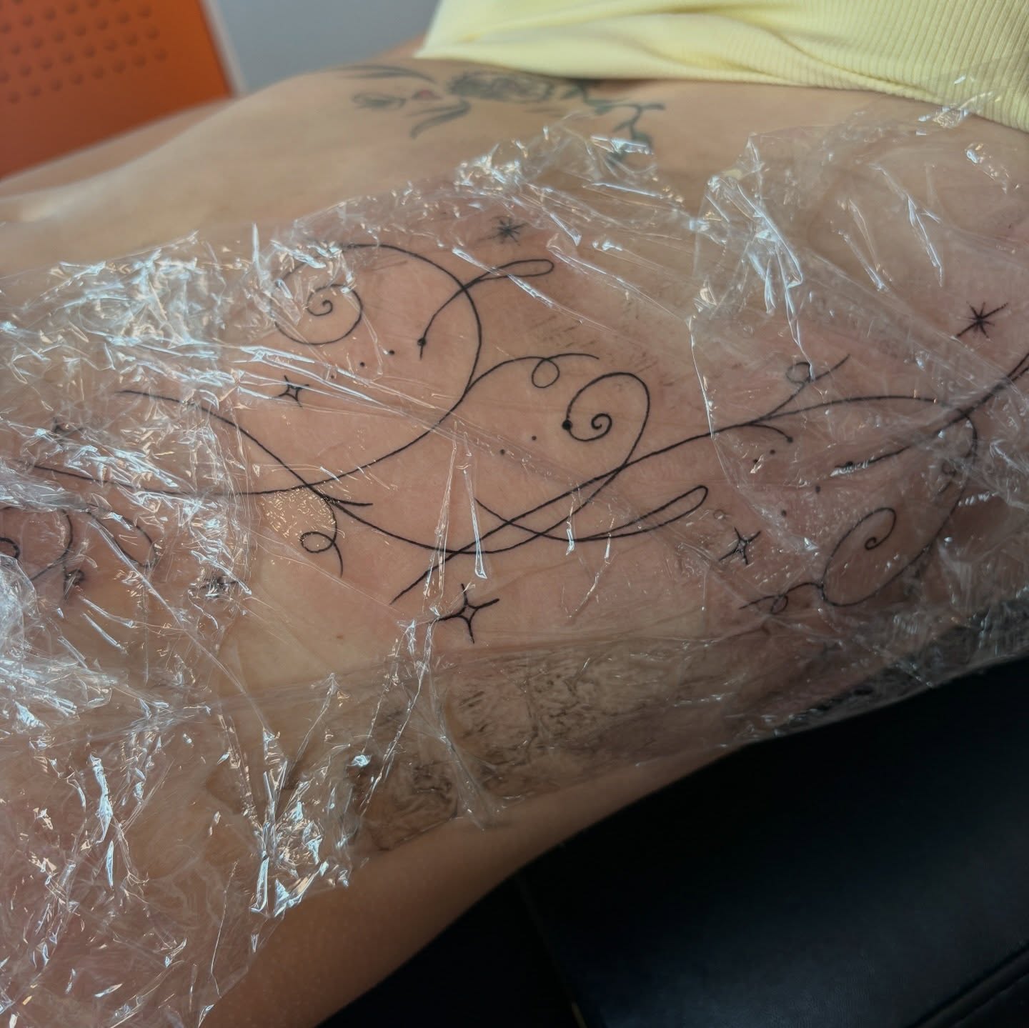 Swirls and stars fine line tattoo on the thigh by Emma🌸✨Austin Tattoo Artist