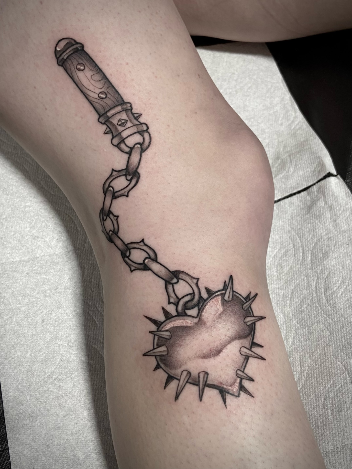 Knife and chain realism tattoo on the forearm by Zac Byrd