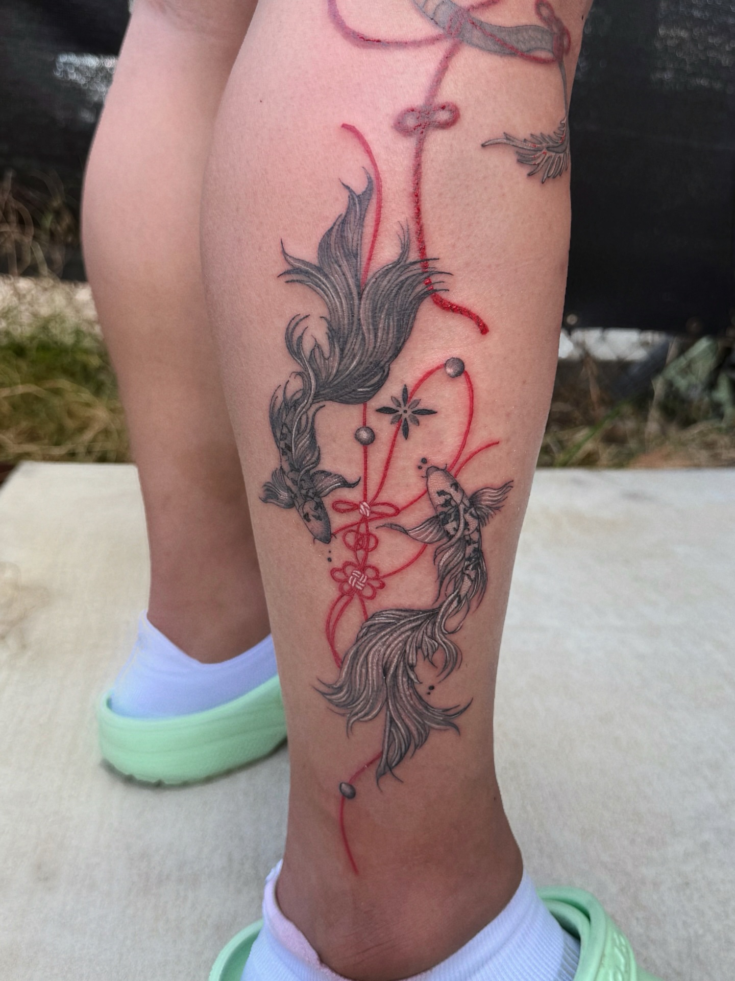 Koi fish black and grey tattoo on the calf by MJ