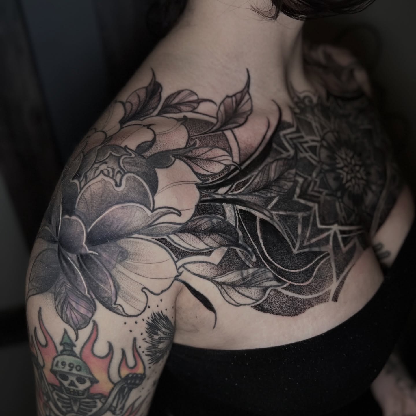 Floral bouquet dotwork tattoo on the shoulder by Dominick Cali, East Islip, New York