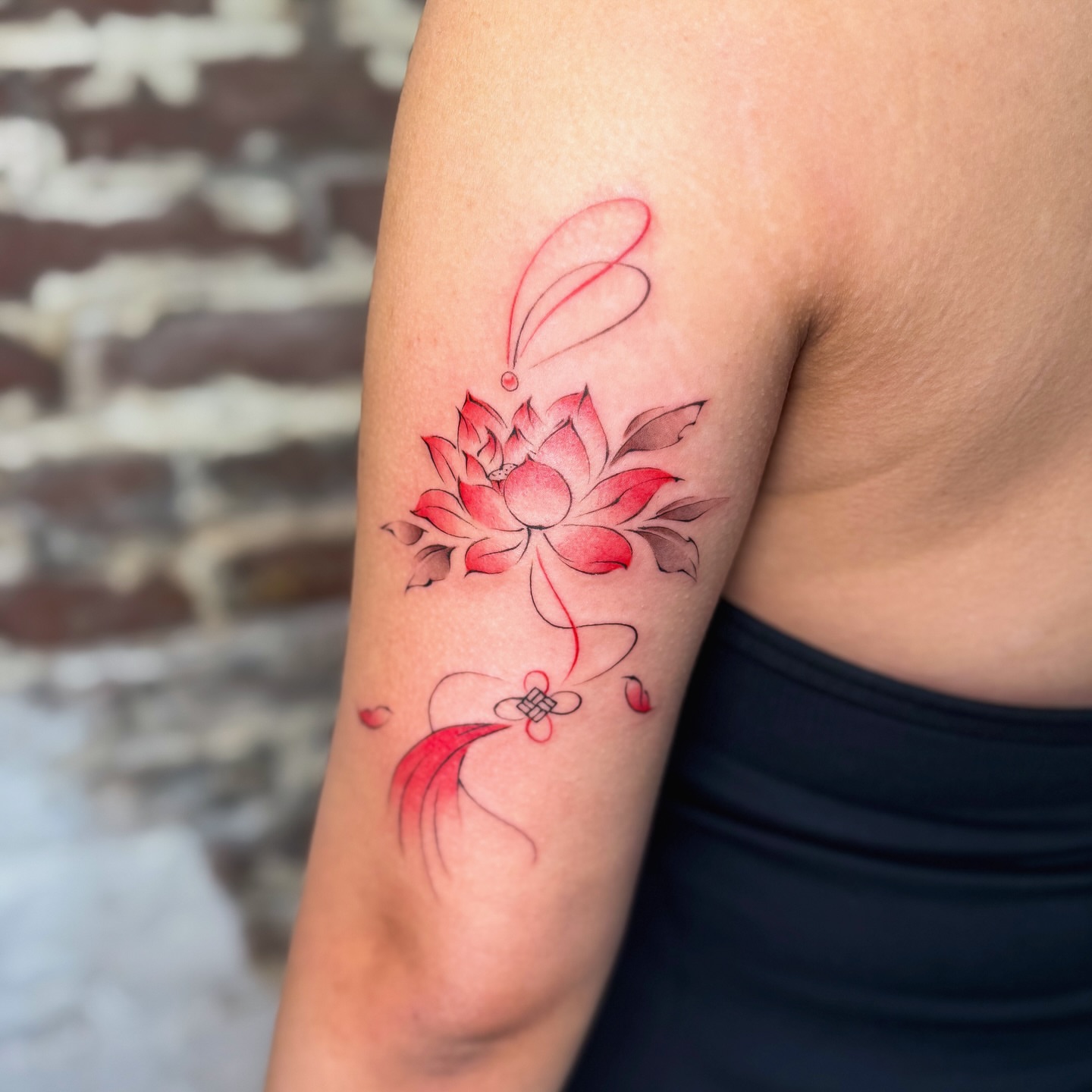 Lotus flower watercolor tattoo on the forearm by justin