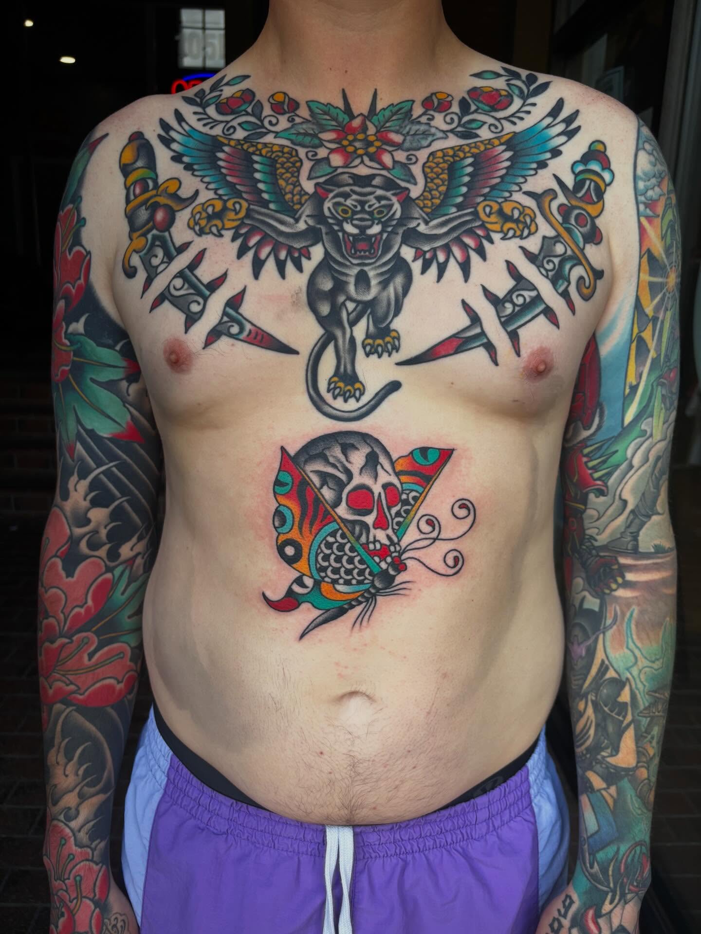 Panther and skull American traditional tattoo on the chest by Chris Dufresne