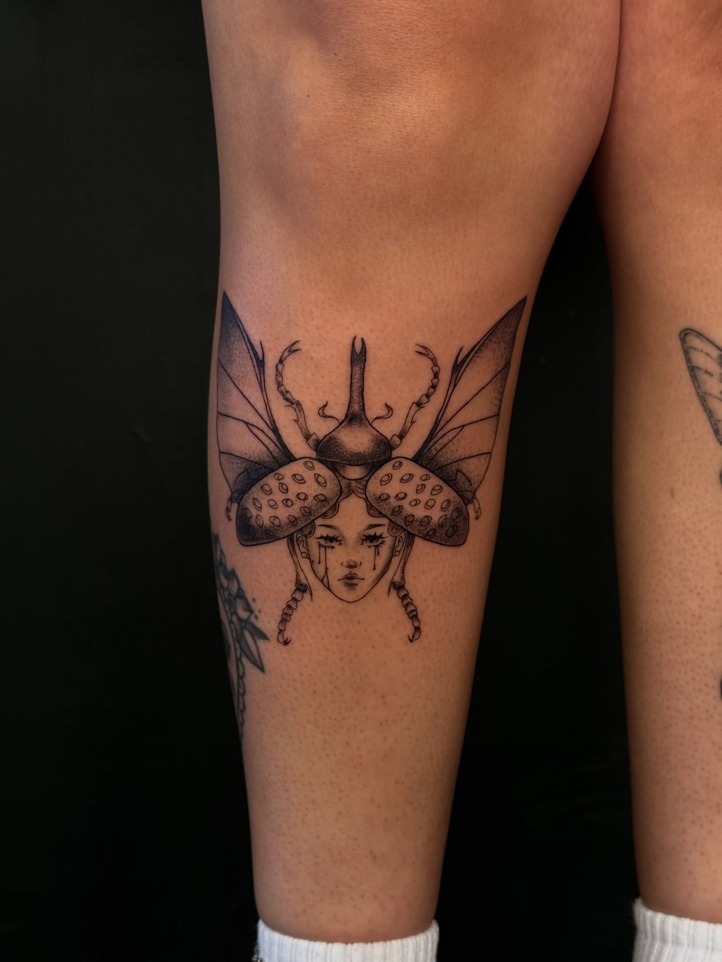 Insect with human face dotwork tattoo on the forearm by šianca٠࣪ā