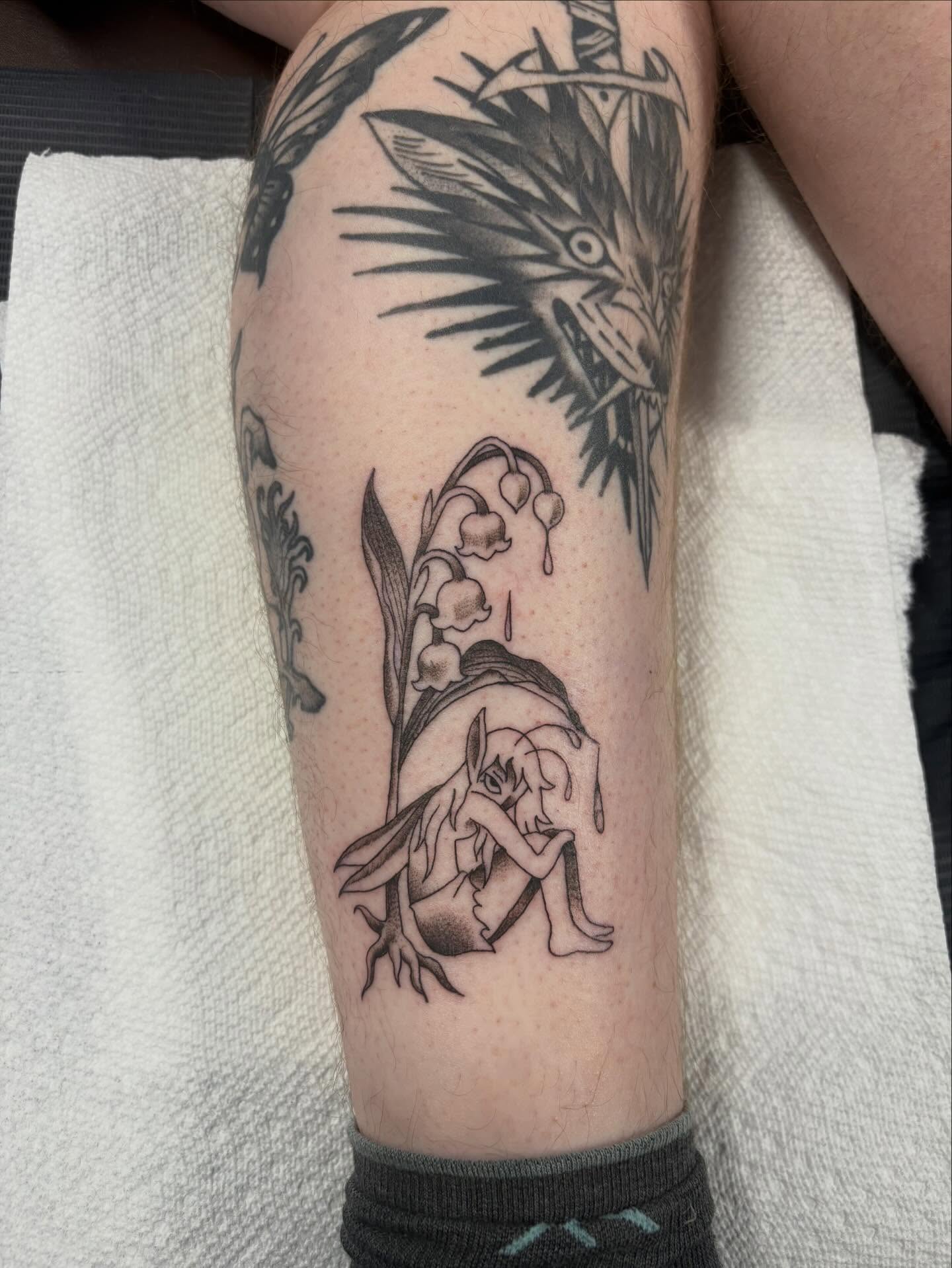Elf and lilies of the valley realism tattoo on the forearm by Nolan Croteau