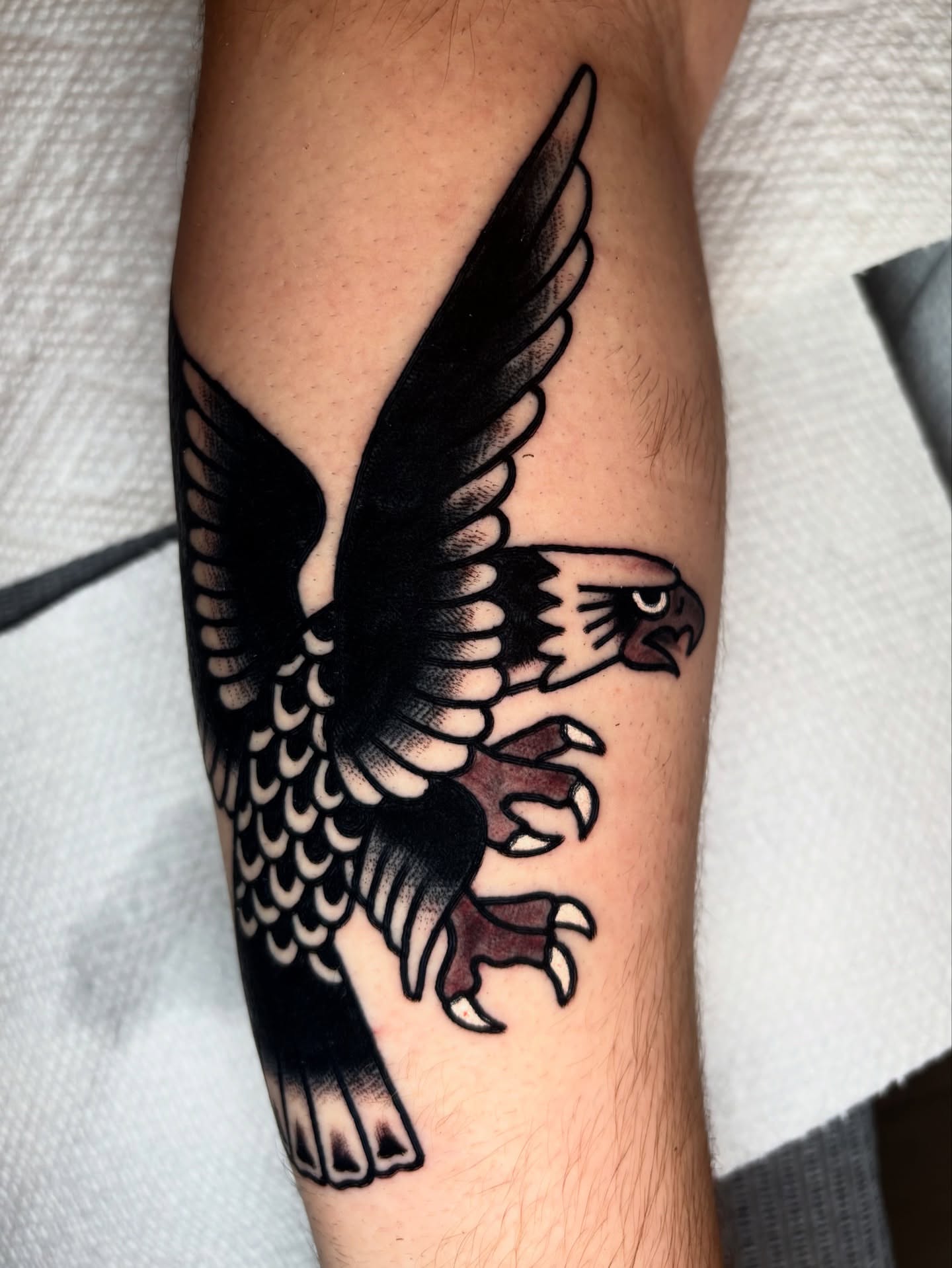 Eagle black and grey tattoo on the forearm by Santo Zelaya, San Francisco, California