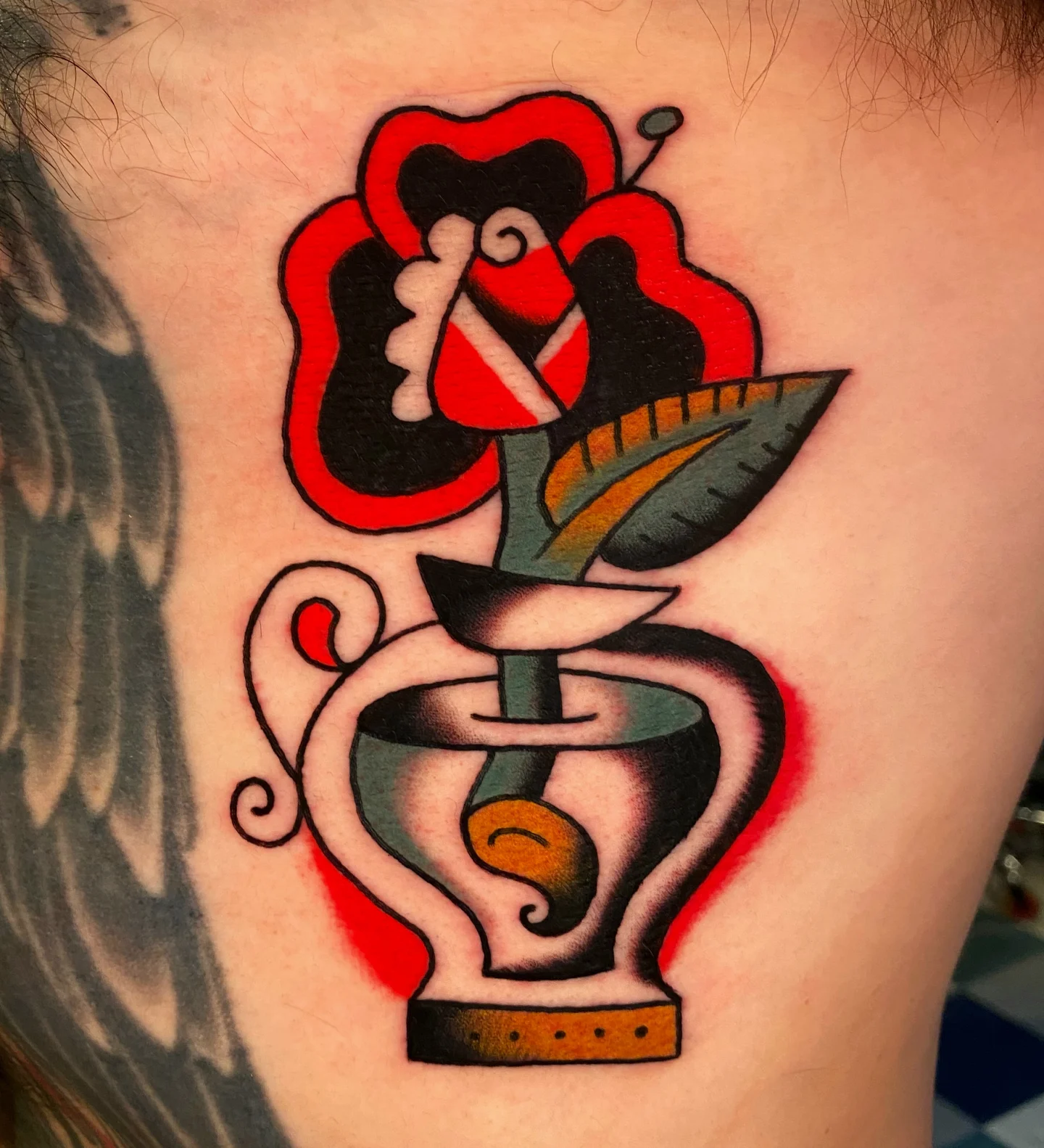 Pharmacy symbol with rose American traditional tattoo on the ribs by Quinn, Kansas City, Missouri
