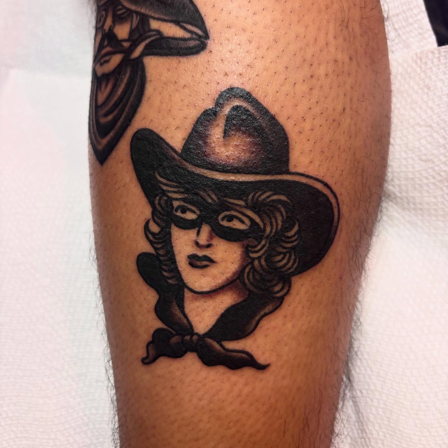 Cowboy mask black and grey tattoo on the forearm by Danny DiBlasi, San Francisco, California