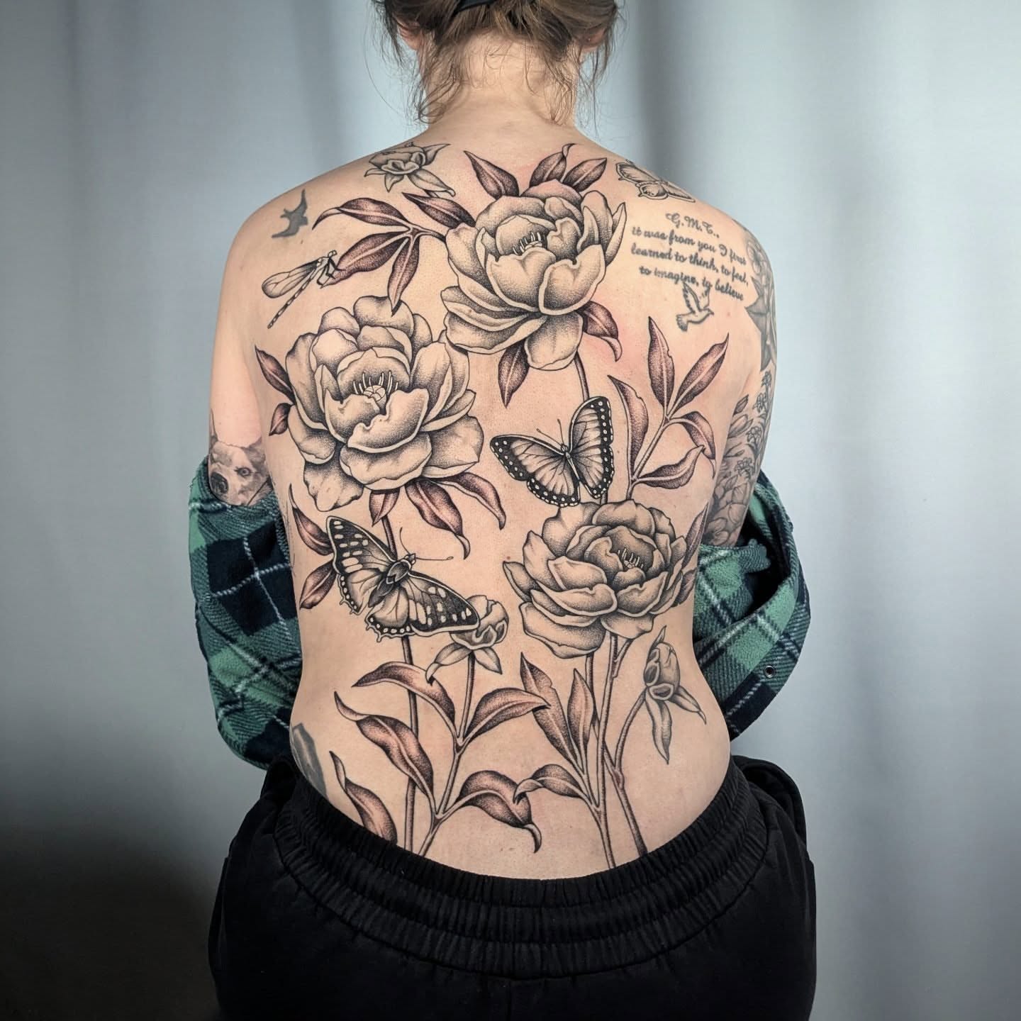 Peonies and butterflies realism tattoo on the back by Courtney Yaddof