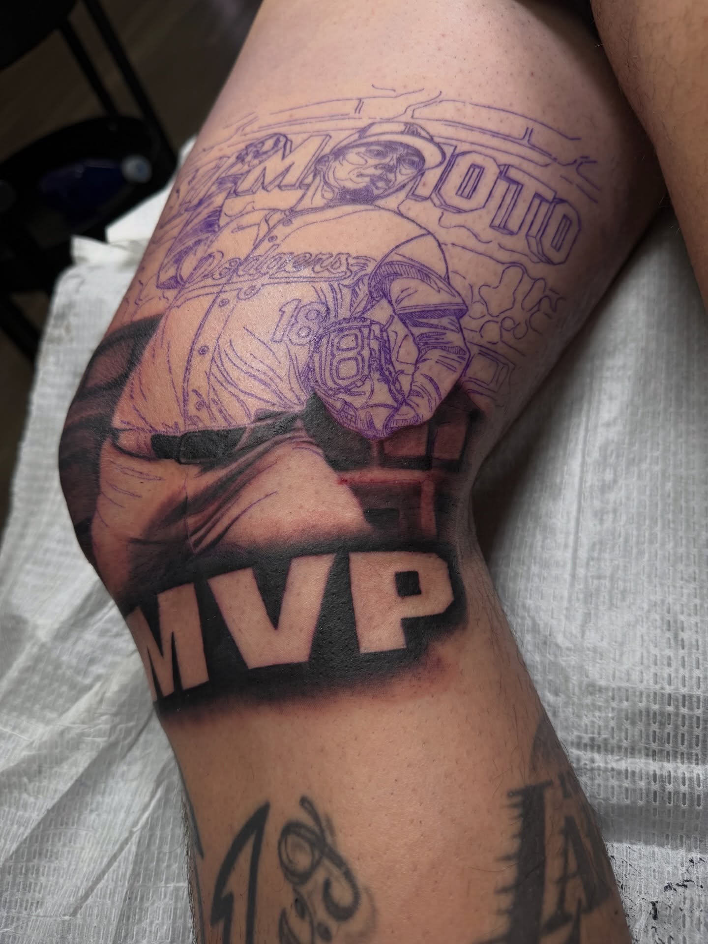 Football player realism tattoo on the thigh by Nathan Guerrero