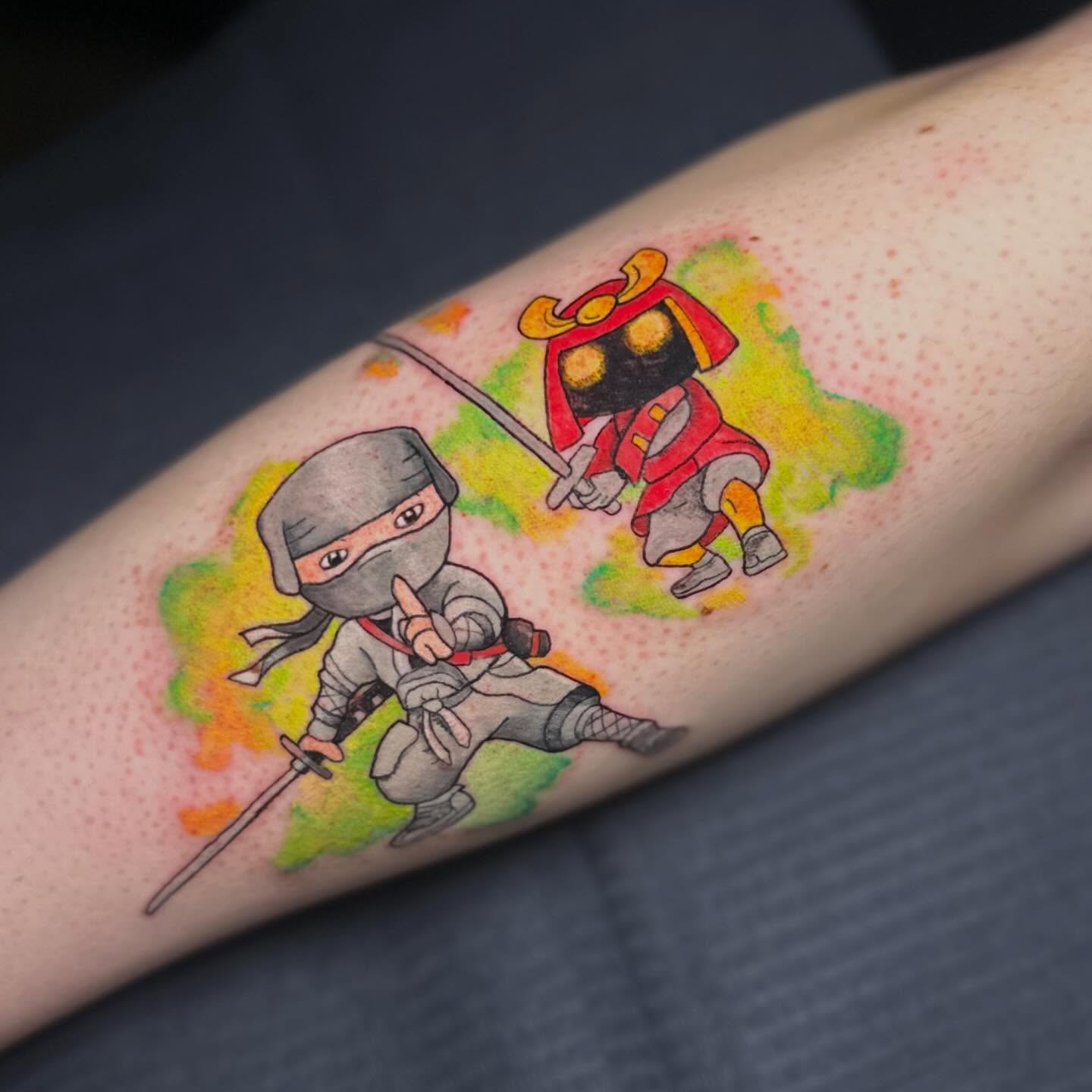 Ninjas watercolor tattoo on the forearm by Sam, Mount Laurel, New Jersey