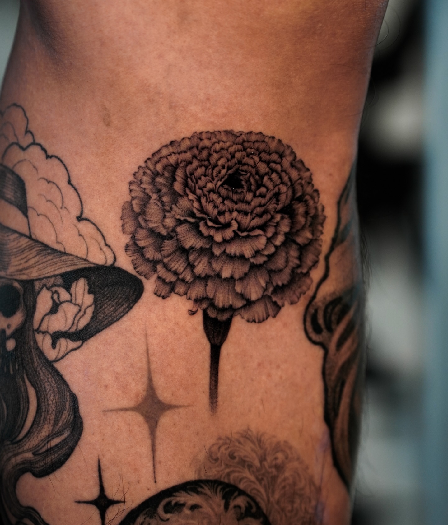 Flower black and grey tattoo on the forearm by Sophia Delfino