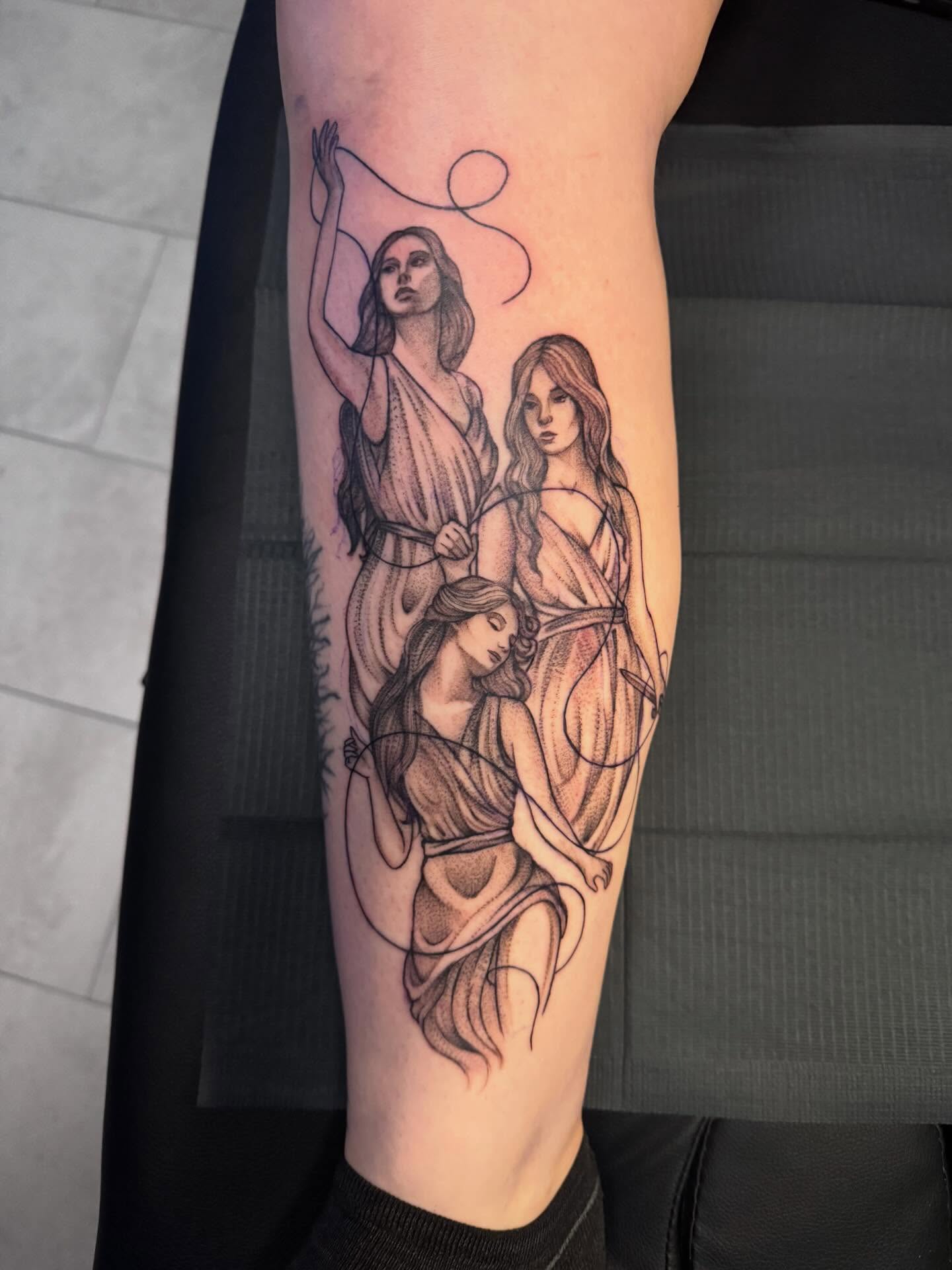 Three women black and grey tattoo on the forearm by Lindsay