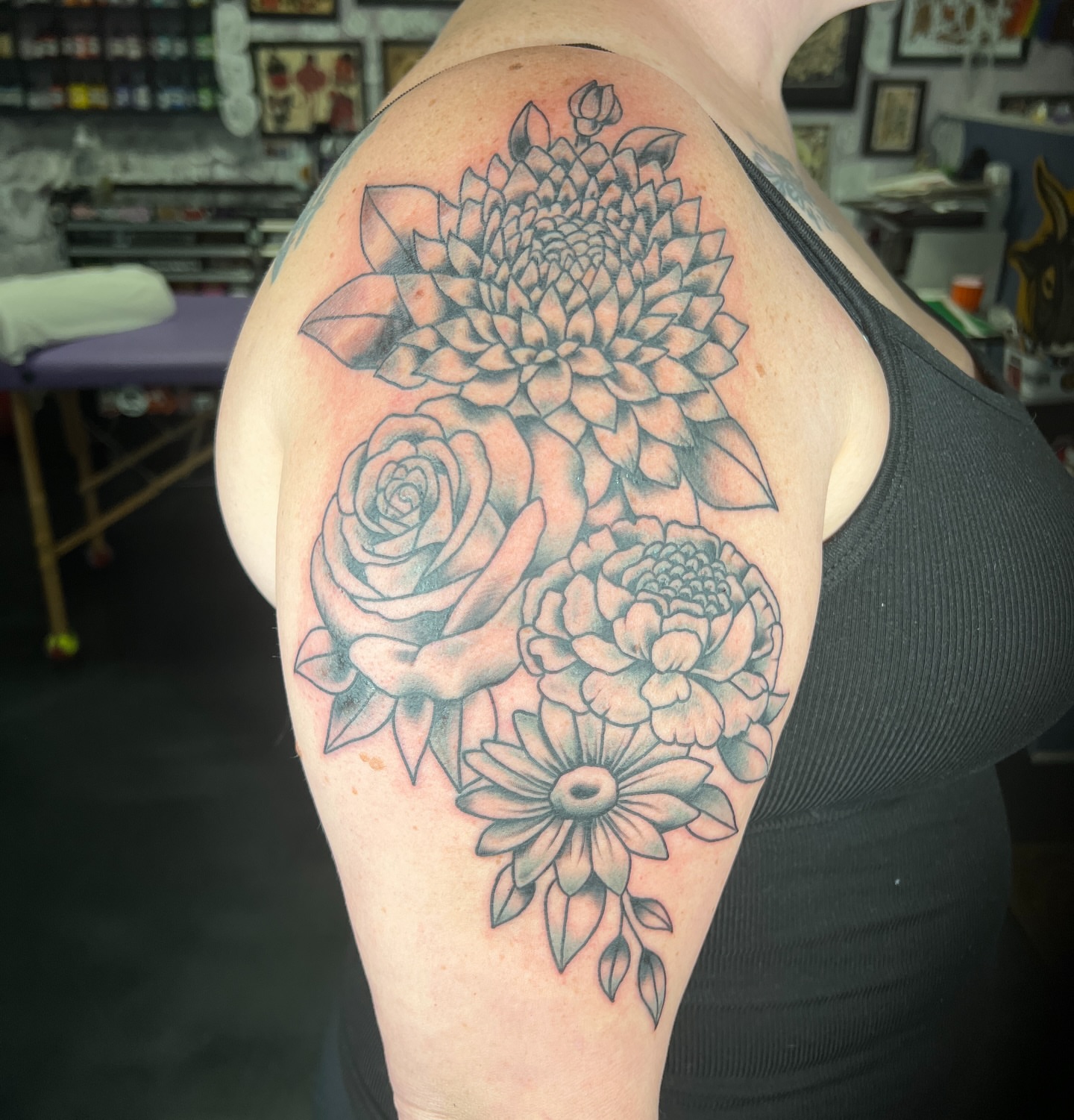 Floral bouquet black and grey tattoo on the shoulder by Brian Mock