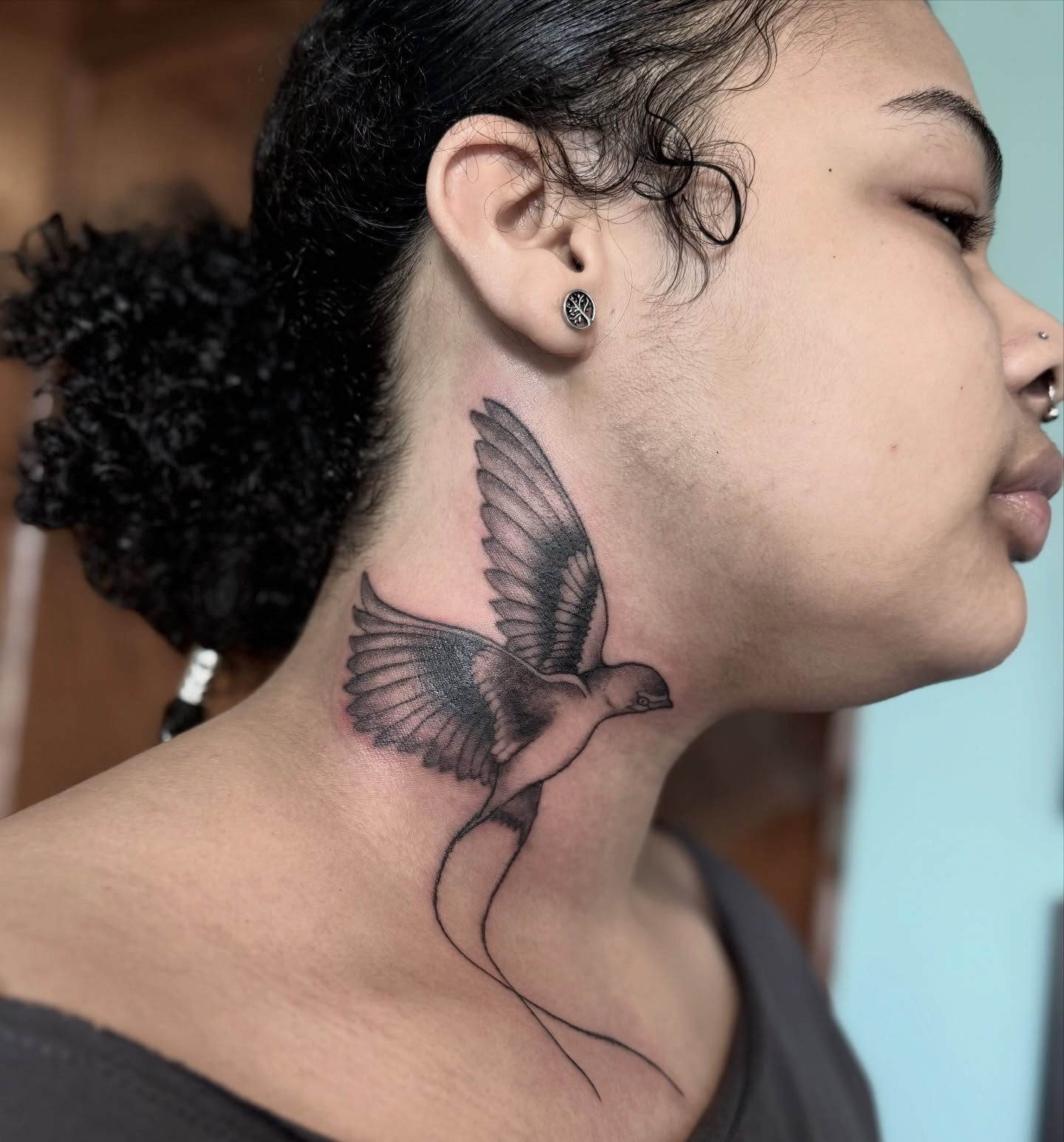 Bird black and grey tattoo on the neck by Bronzino Ink - Karen, Asheville, North Carolina