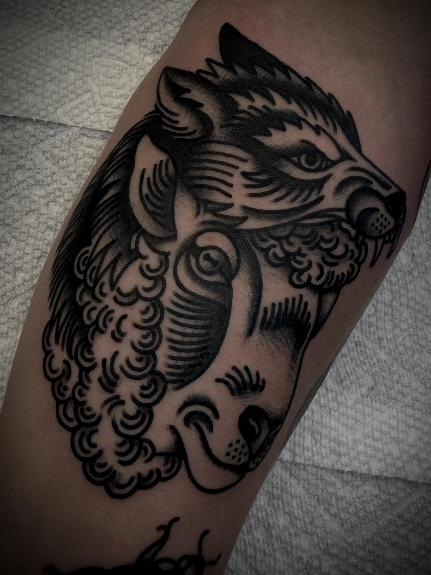 Badger and fish American traditional tattoo on the forearm by Andrew Slater