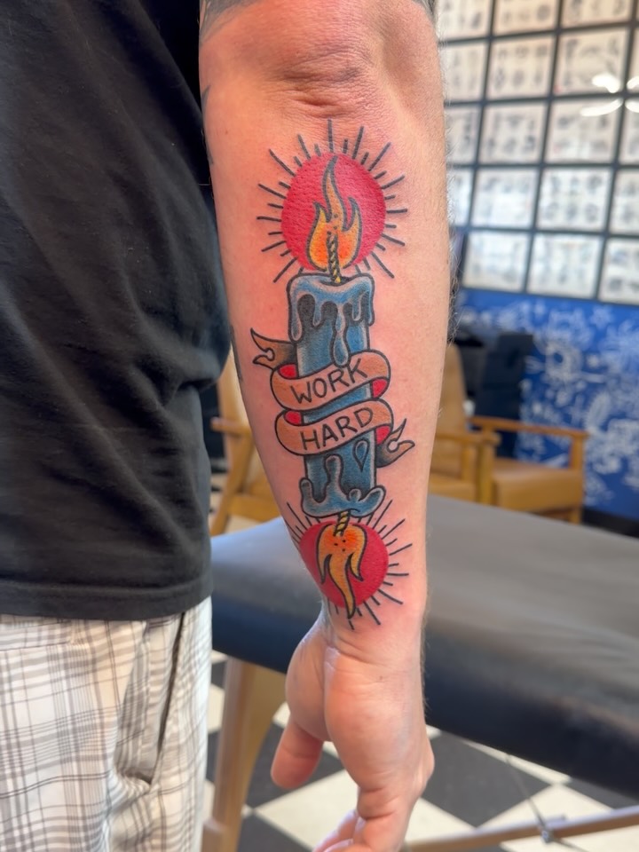 Candle with banner American traditional tattoo on the forearm by Don Robison