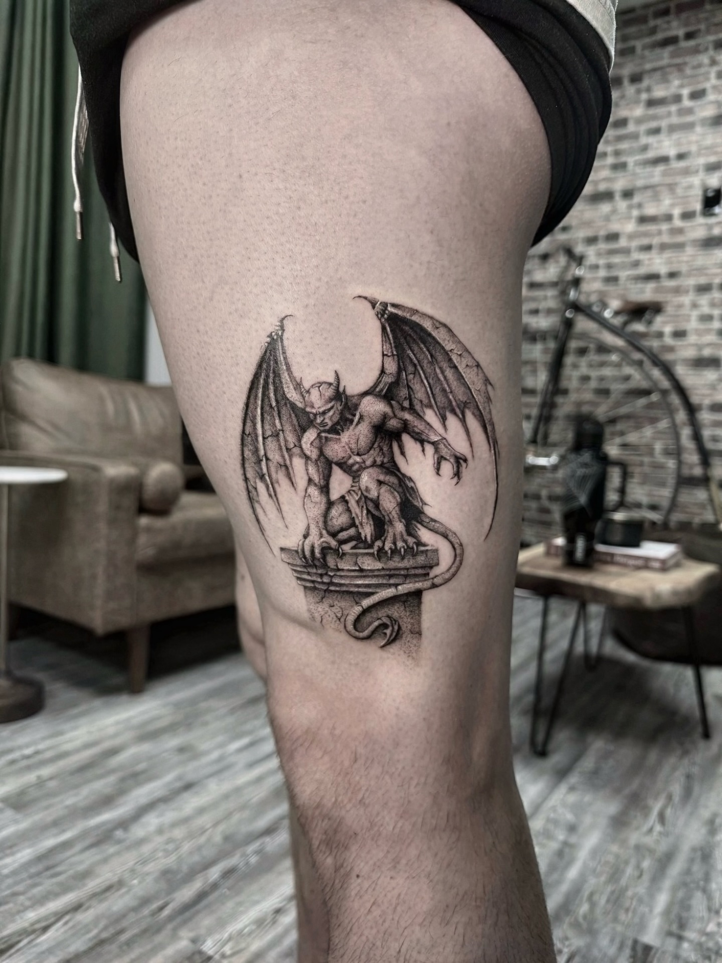 Gargoyle black and grey tattoo on the thigh by Miro Ink Tattoo