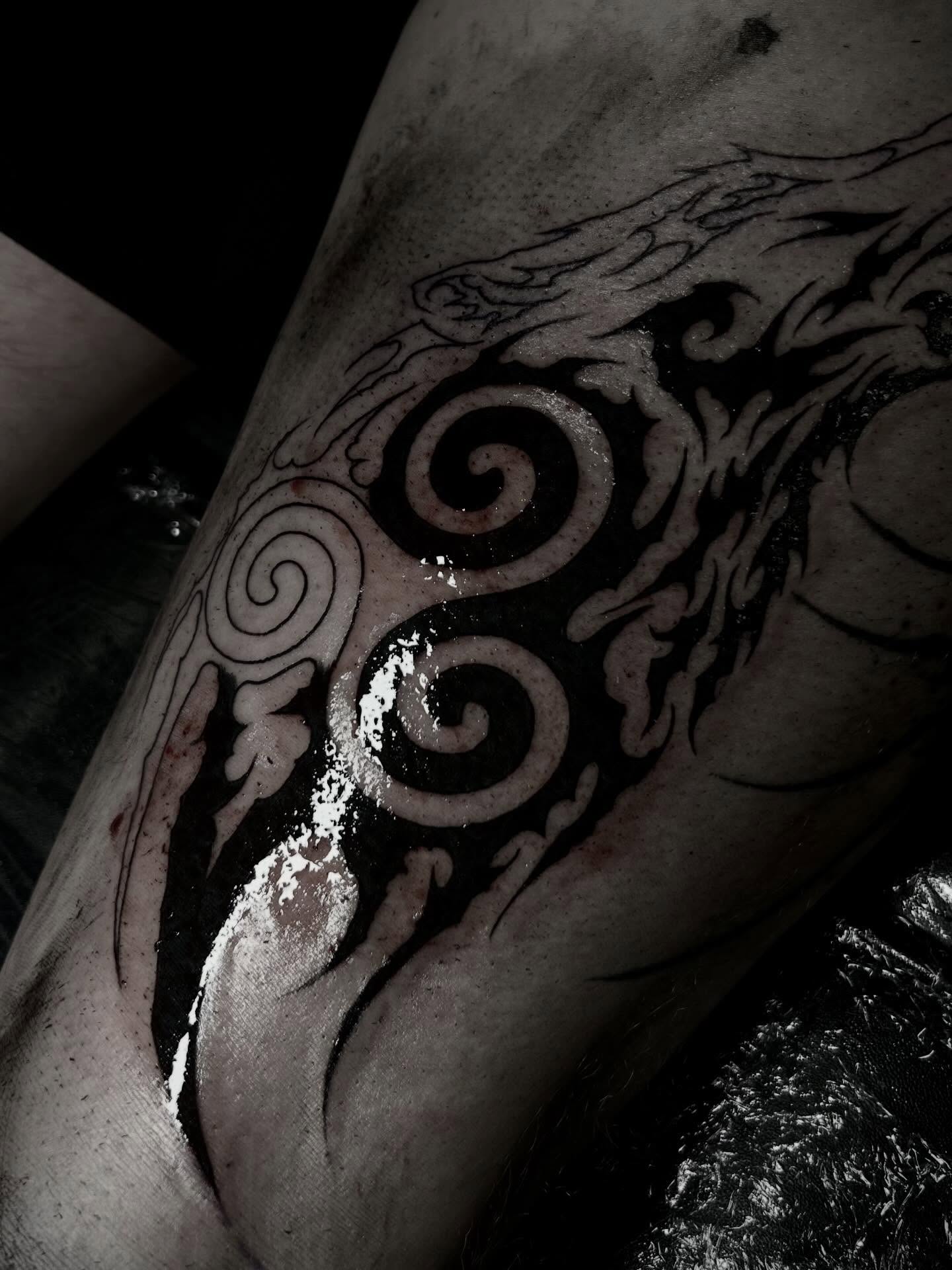 Spirals and flames tribal tattoo on the forearm by Heaven Arianna