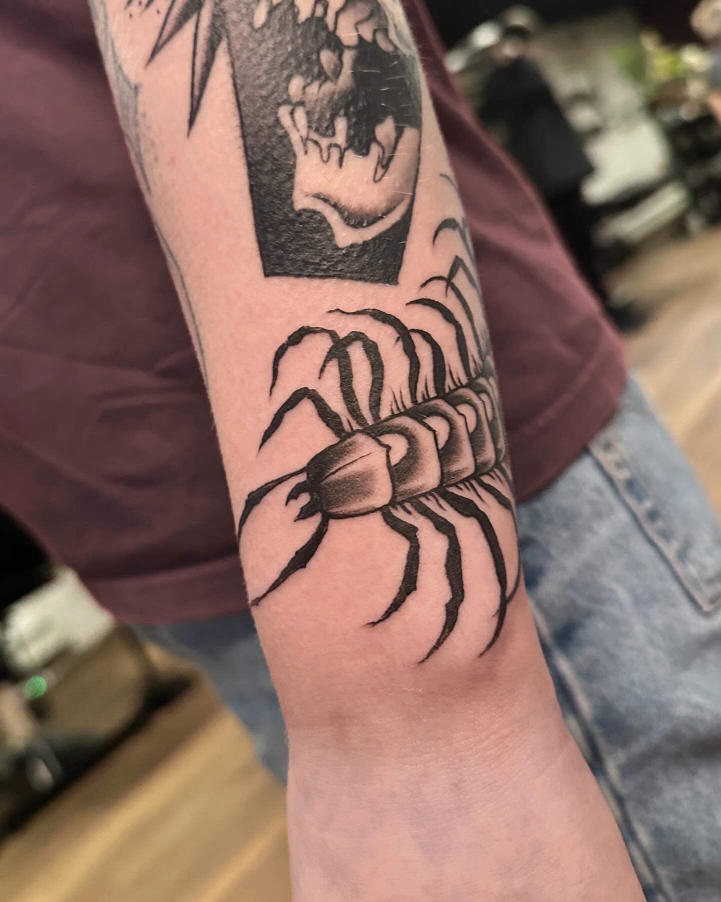 Scorpion black and grey tattoo on the forearm by Craig Ryans