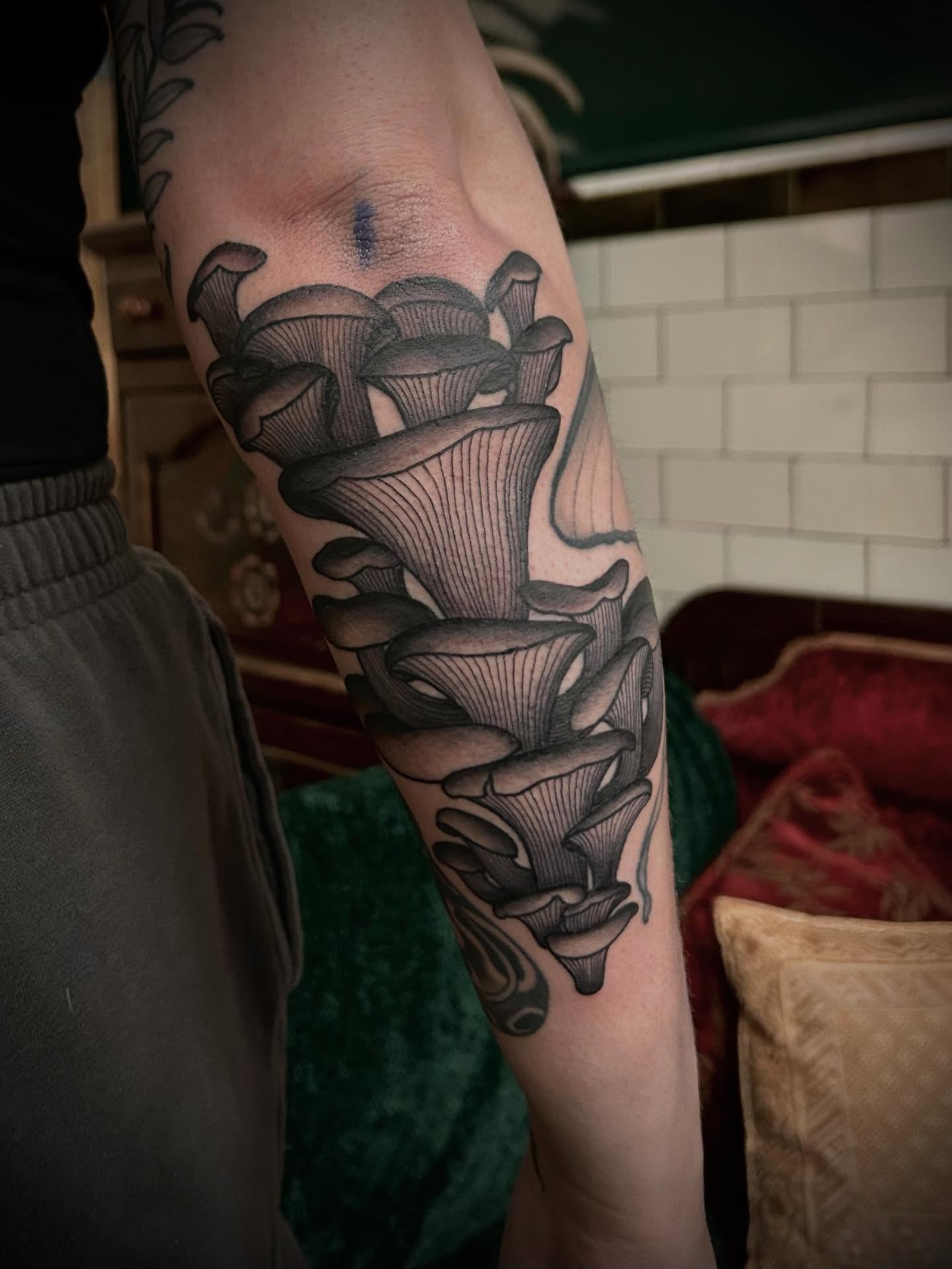 Calla lilies black and grey tattoo on the forearm by ꧁𝙺𝚊𝚛𝚒𝚗𝚊꧂, Grinnell, Iowa