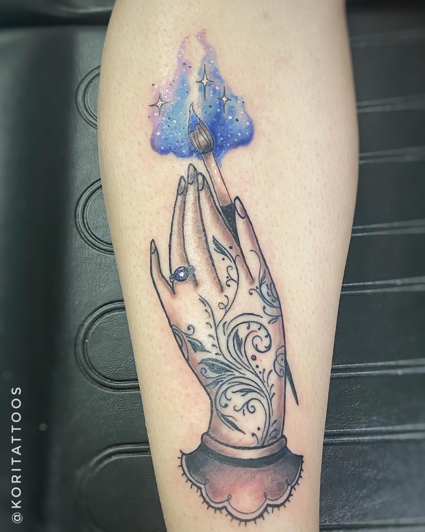 Praying hands with candle watercolor tattoo on the forearm by Kori Millhimes