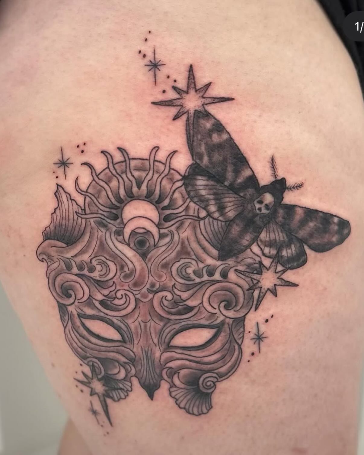Mask with moth surrealism tattoo on the shoulder by Kori Millhimes