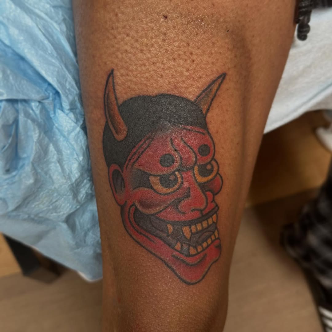 Japanese demon mask neo-traditional tattoo on the thigh by norawillstattoo