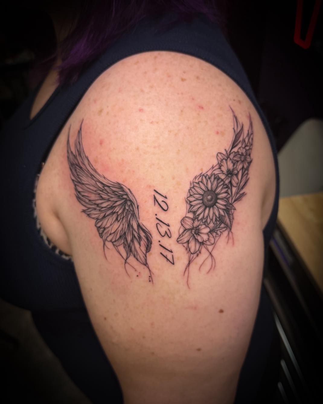 Wings and flowers black and grey tattoo on the shoulder by 𝔻𝕖𝕣𝕣𝕚𝕔𝕜 𝔹𝕦𝕪𝕖𝕒, East Aurora, New York