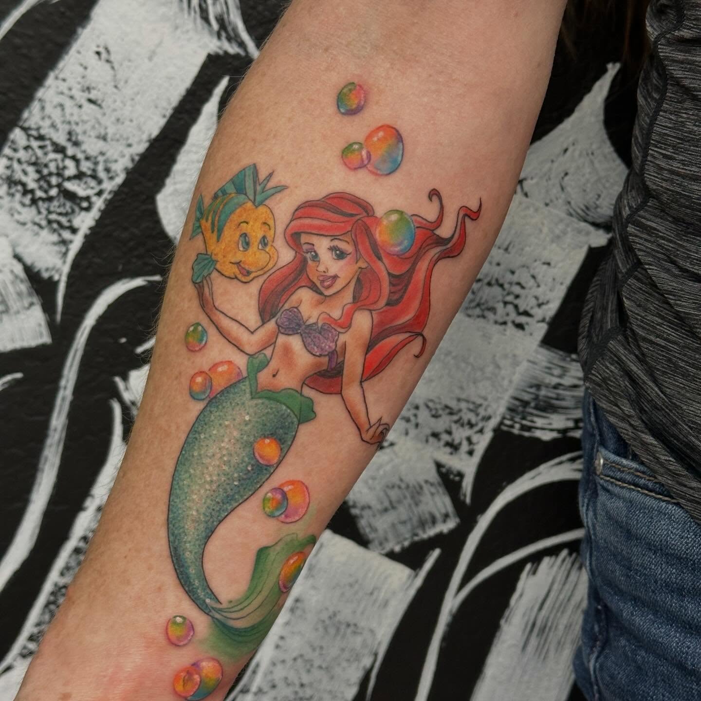 Mermaid and friend new school tattoo on the forearm by Katrina Aldaco 🧿 Tattoo Artist