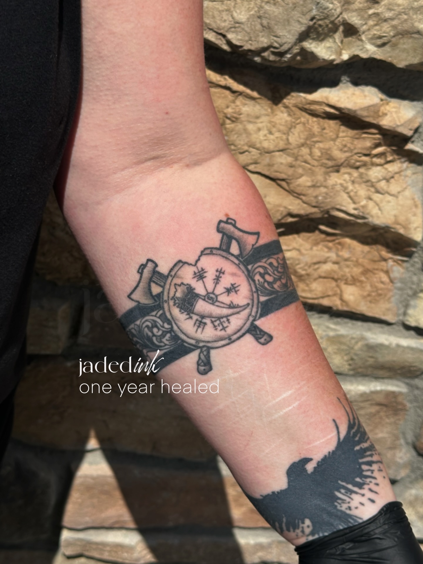 Compass and axe black and grey tattoo on the forearm by 𝑱𝒂𝒅𝒆𝒅 𝑰𝒏𝒌 𝑷𝒆𝒓𝒎𝒂𝒏𝒆𝒏𝒕 𝑴𝒂𝒌𝒆𝒖𝒑 & 𝑻𝒂𝒕𝒕𝒐𝒐