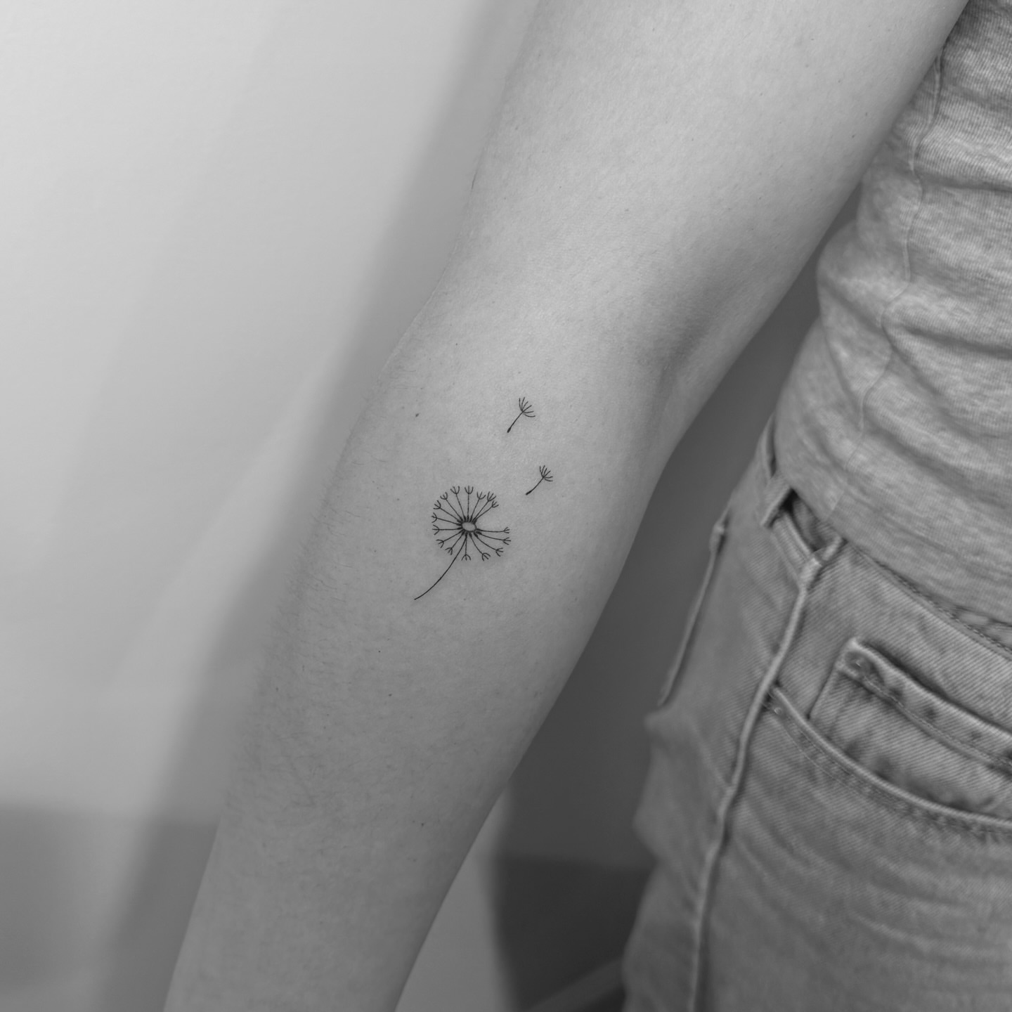 Dandelion minimalist tattoo on the forearm by Jessica, Cheektowaga, New York