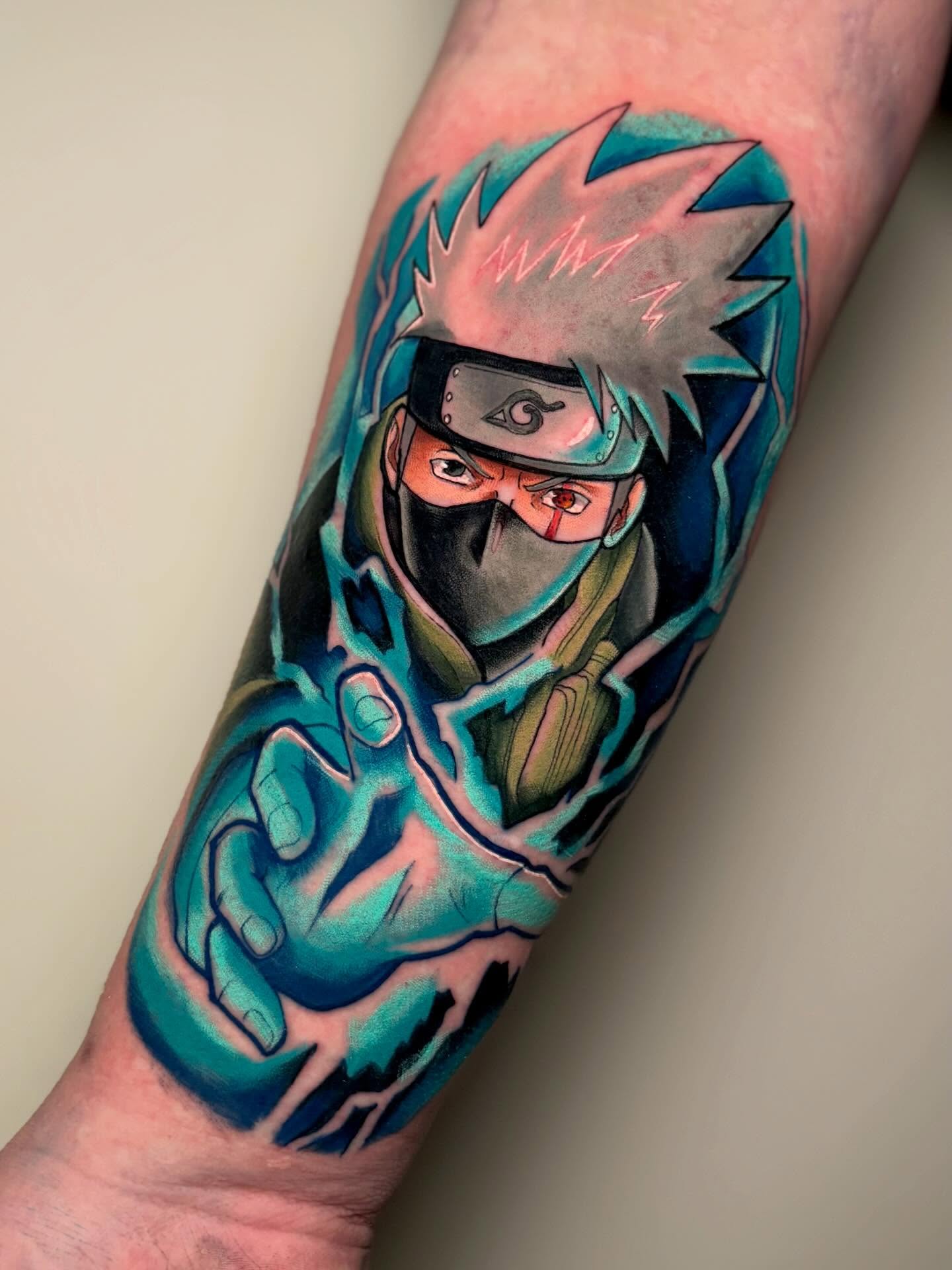 Anime character anime tattoo on the forearm by Jess