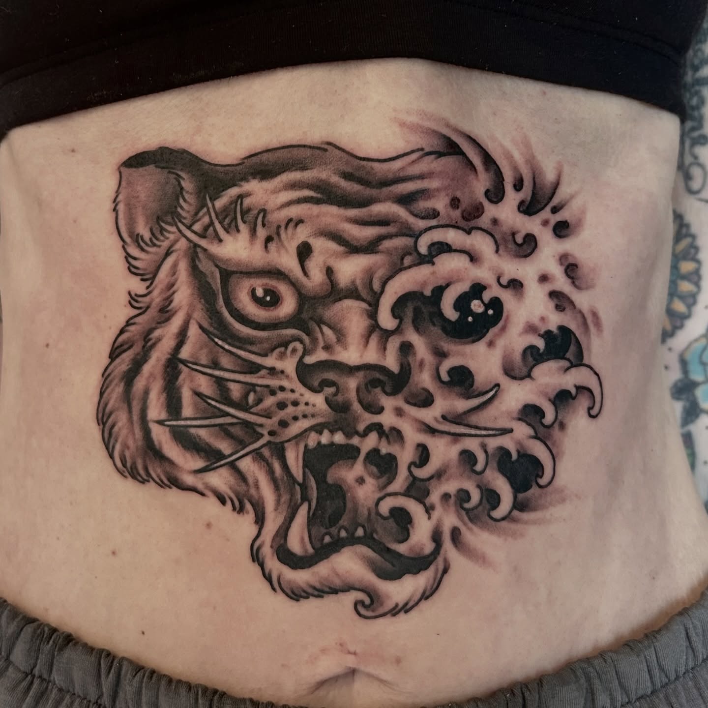 Tiger black and grey tattoo on the torso by Justin Weatherholtz, New York, New York