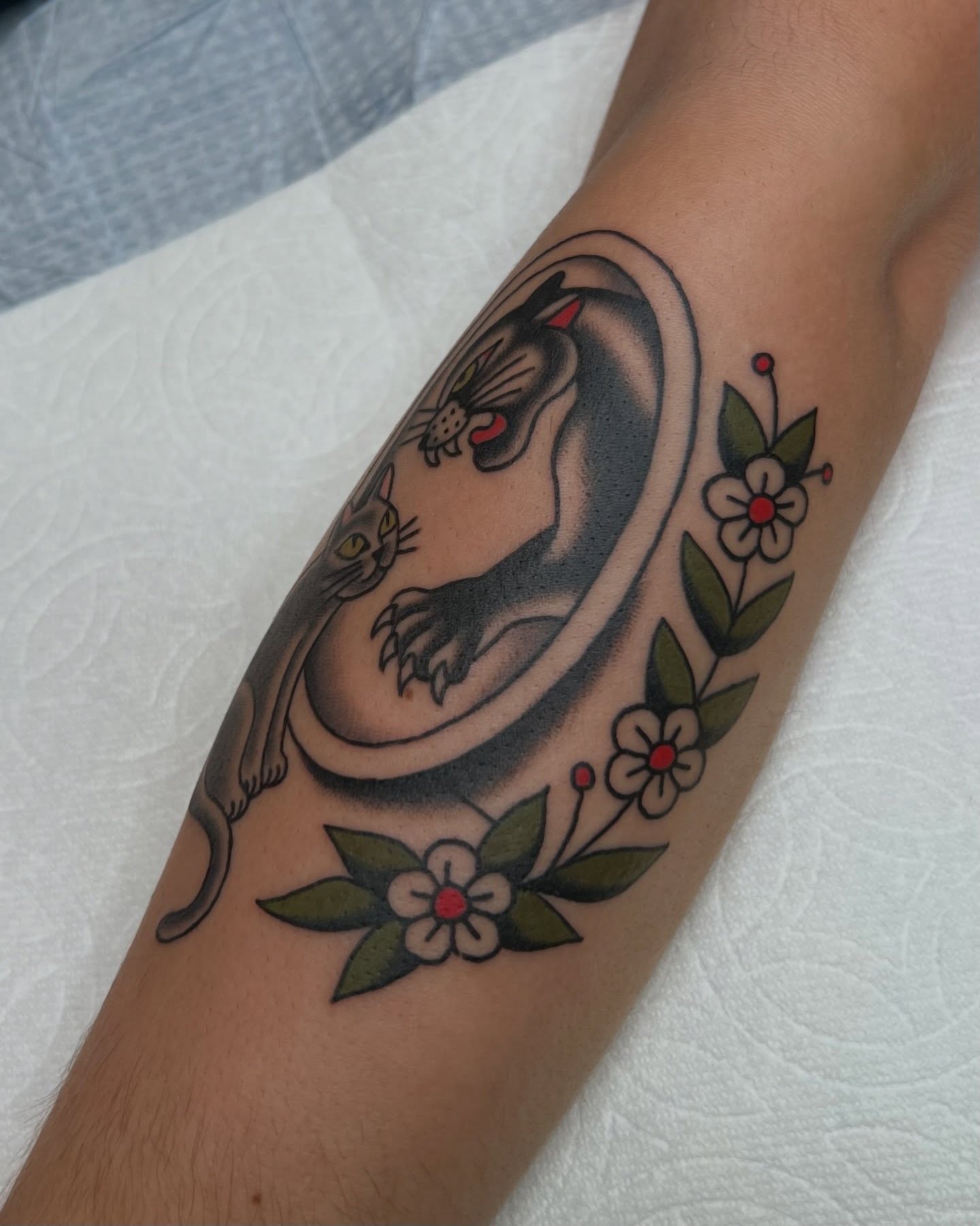 Panther and flowers American traditional tattoo on the forearm by Brian Visser