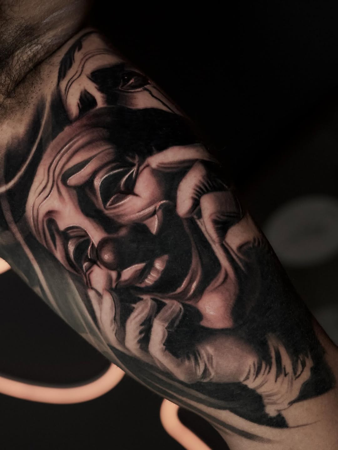 Clown face realism tattoo on the forearm by Bapone