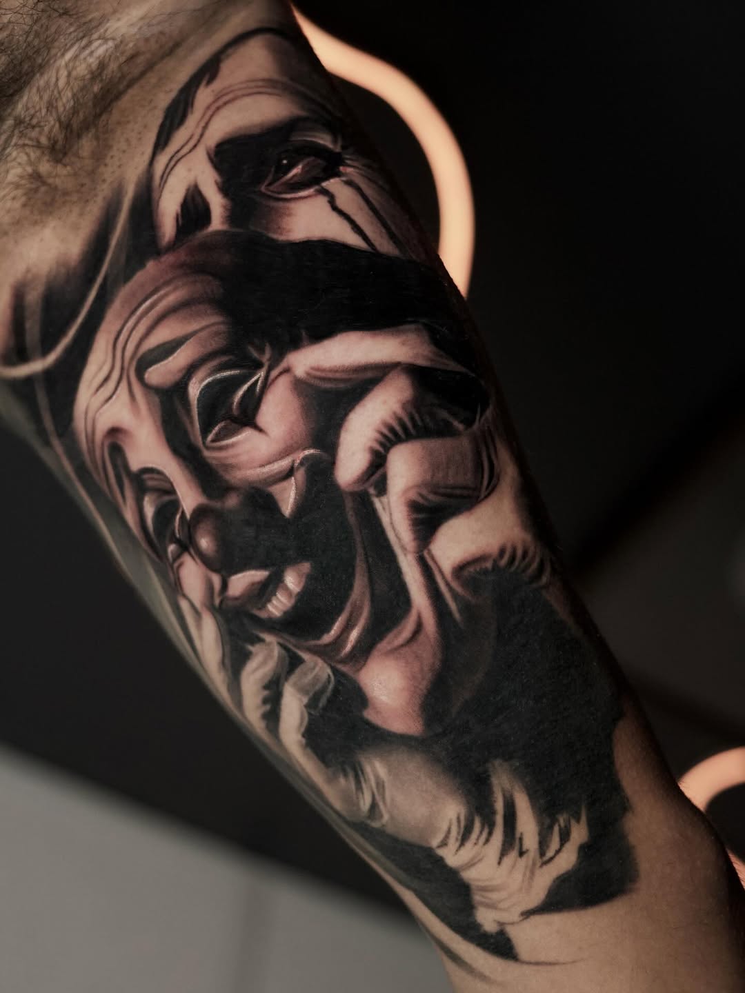 Clown face realism tattoo on the forearm by Bapone