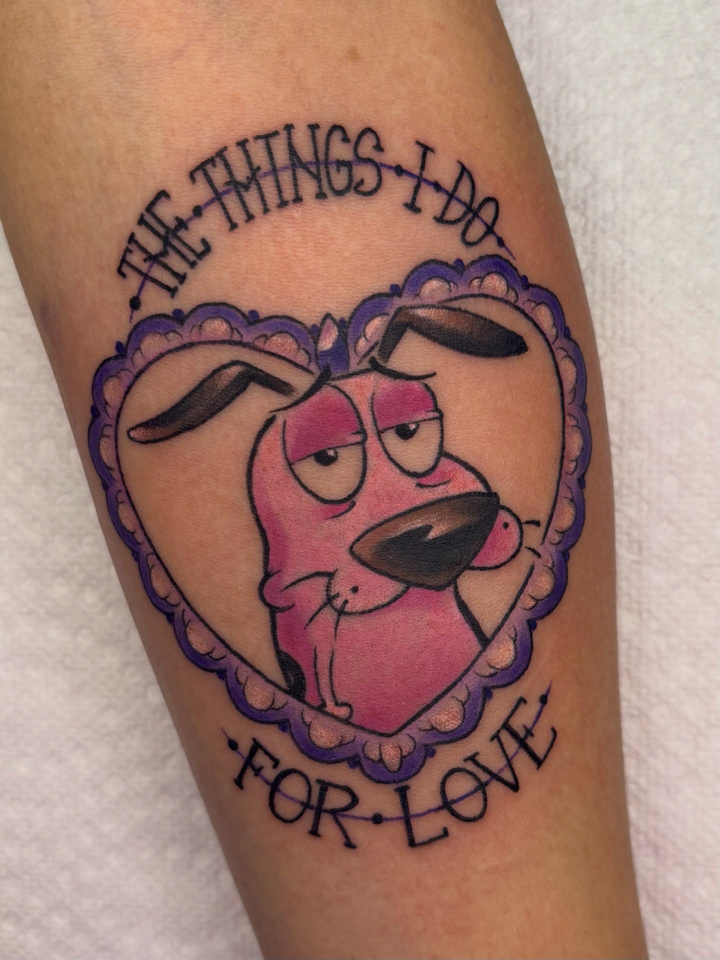 Dog and cat illustrative tattoo on the forearm by Lilac Rose