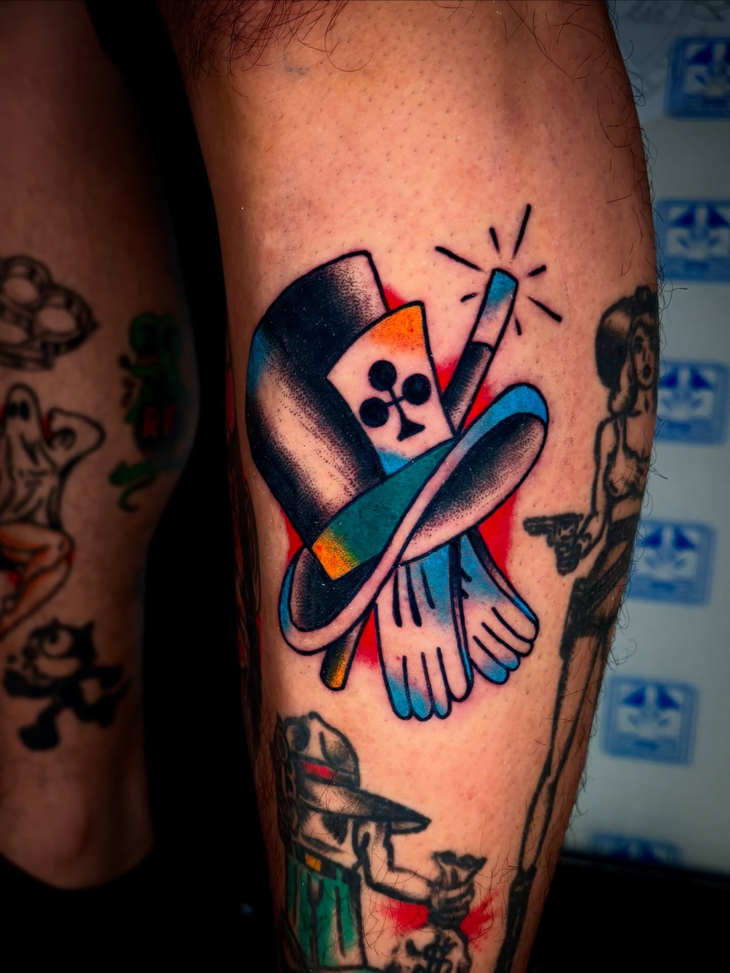 Top hat and bird American traditional tattoo on the forearm by Alex Muniz